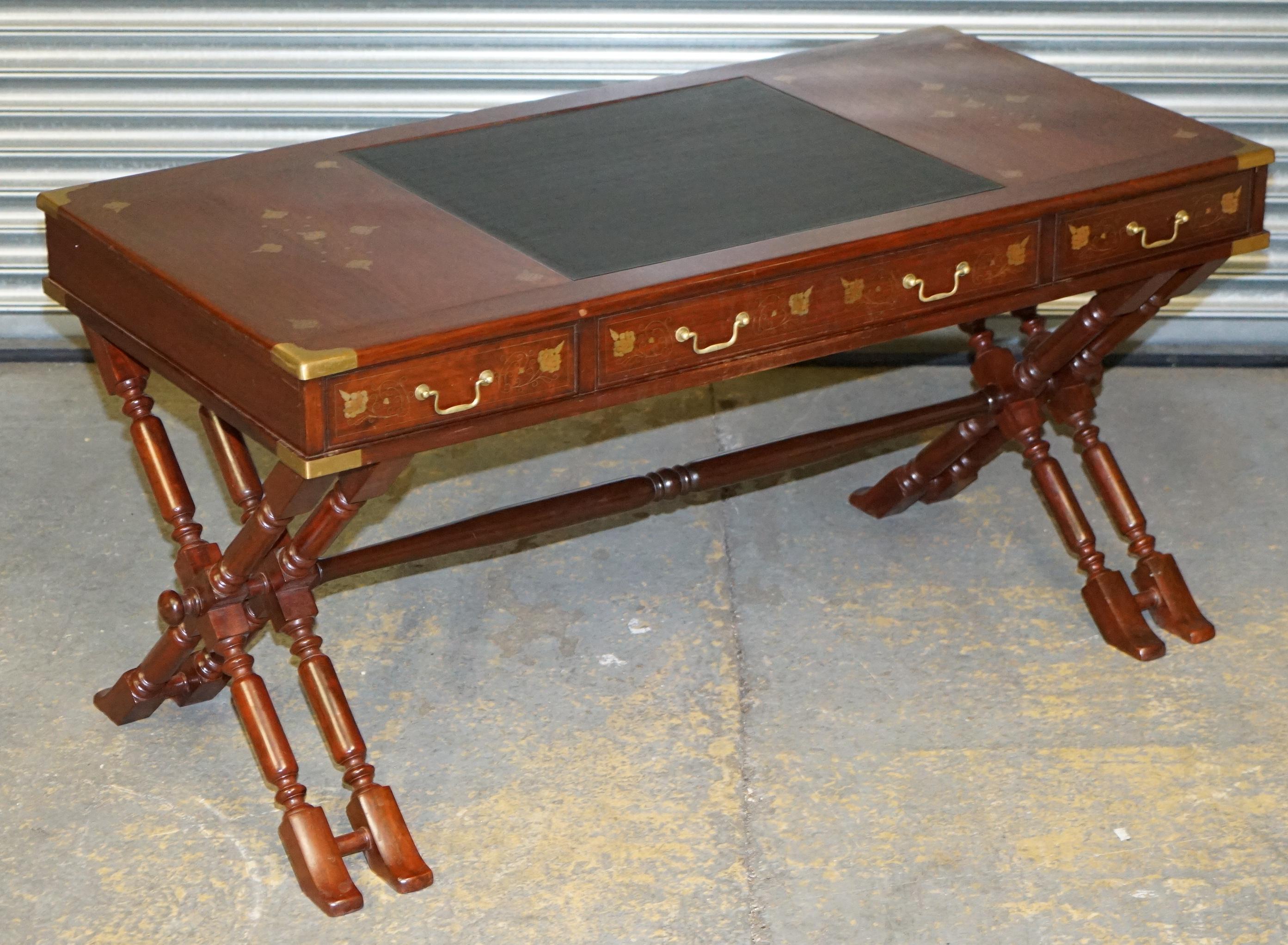 We are delighted to offer for sale this lovely large vintage circa 1960s hardwood with brass inlay Trestle Campaign desk and matching chair

A very good looking heavy and well made pair, trestle desks go back to the late Victorian era, this is