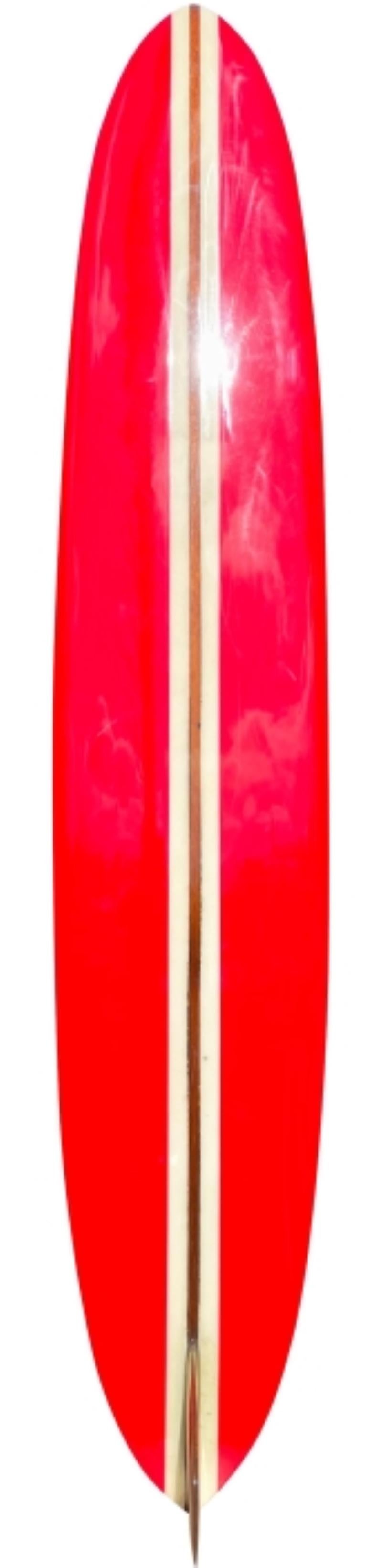 Early 1960s Stanley “Savage” Parks personal longboard by Inter Island Surf Shop. Features beautiful red panels with original wooden fin. Stanley was know as one of the first surfers to ever do bottom-turns on waves at Banzai Pipeline, the famous