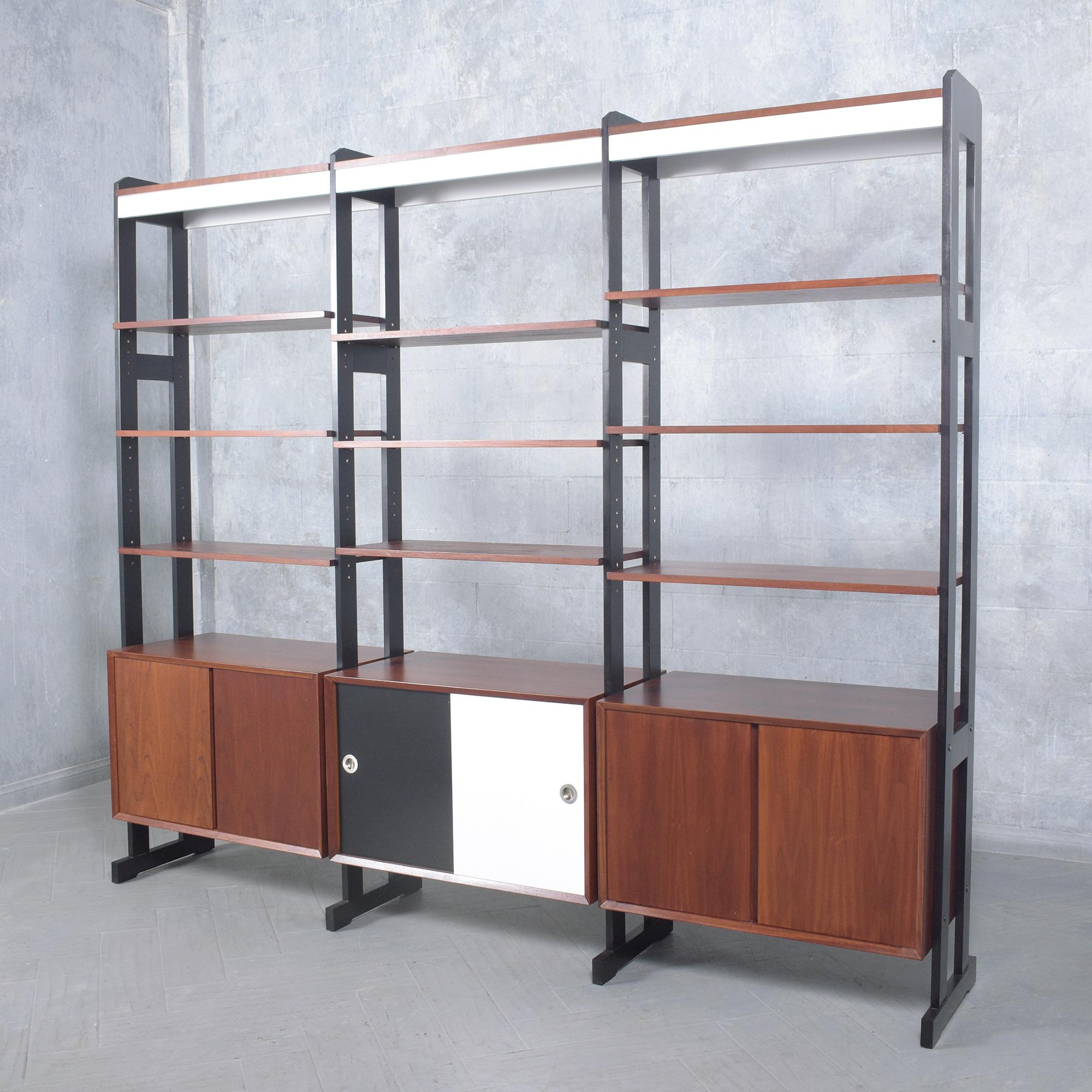 Discover the timeless charm of our fully restored vintage mid-century modern bookshelf, crafted from high-quality teak in the 1960s. This piece features a stunning walnut, white, and black color combination with a satin lacquer finish, enhancing its