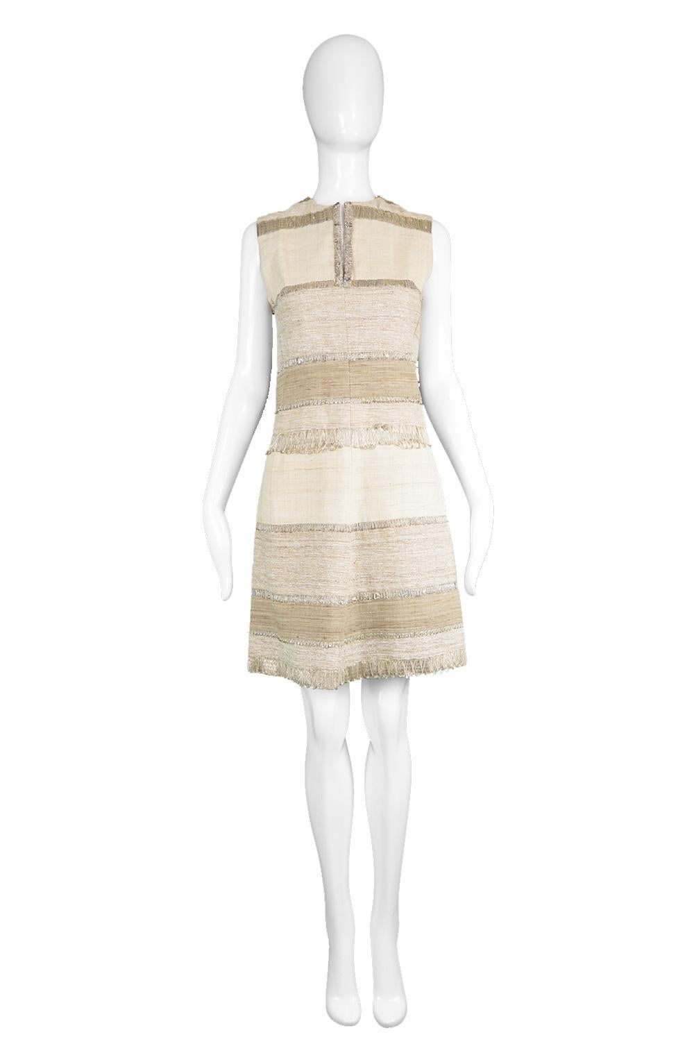 Vintage 1960s Textured Linen & Metallic Cocktail Party Sleeveless Dress

Estimated Size: UK 10/ US 6/ EU 38. Click 'Continue Reading' to see measurements and description. 
Bust - 34” / 86cm
Waist - 28” / 71cm
Hips - 38” / 96cm
Length (Shoulder to