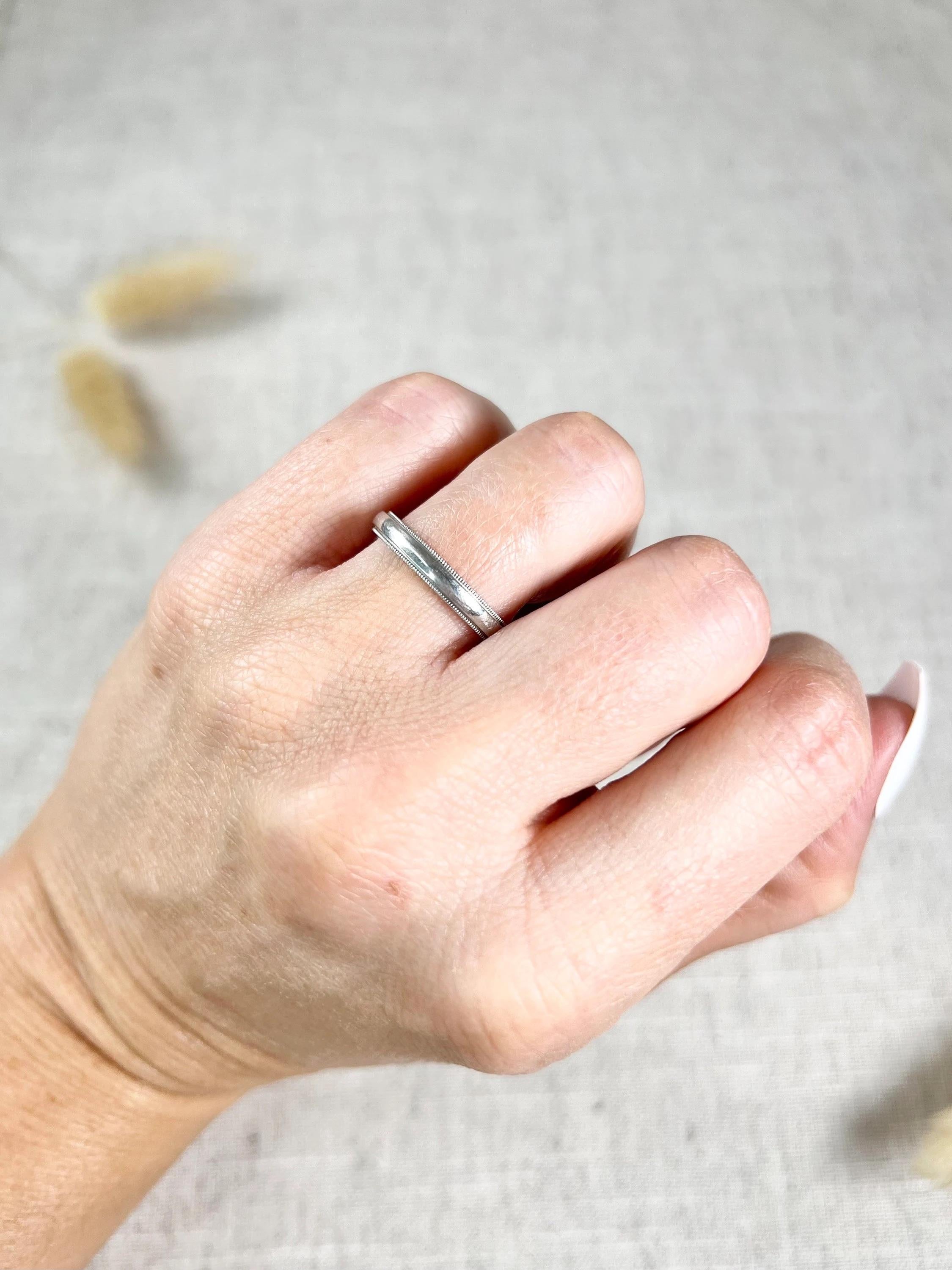 Vintage Tiffany wedding Band

Platinum Stamped 950

Makers Mark Tiffany & Co

Circa 1990s

This vintage Tiffany & Co wedding band is a stunning piece of jewellery that will add a touch of elegance to any wedding ensemble. The band features a