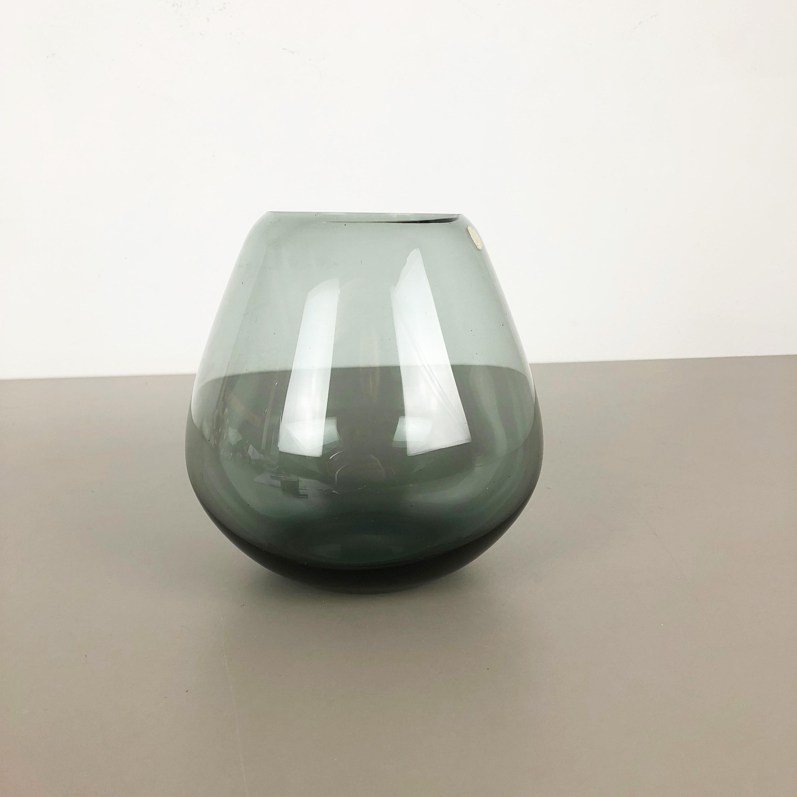 Article:

Glass vase


Producer:

WMF Württembergische Metallwaren Fabrik in Geislingen 


Designer:

Wilhelm Wagenfeld 


Design:

WMF turmalin series


Decade:

1960s


Description:

Original vintage 1960s vase of the