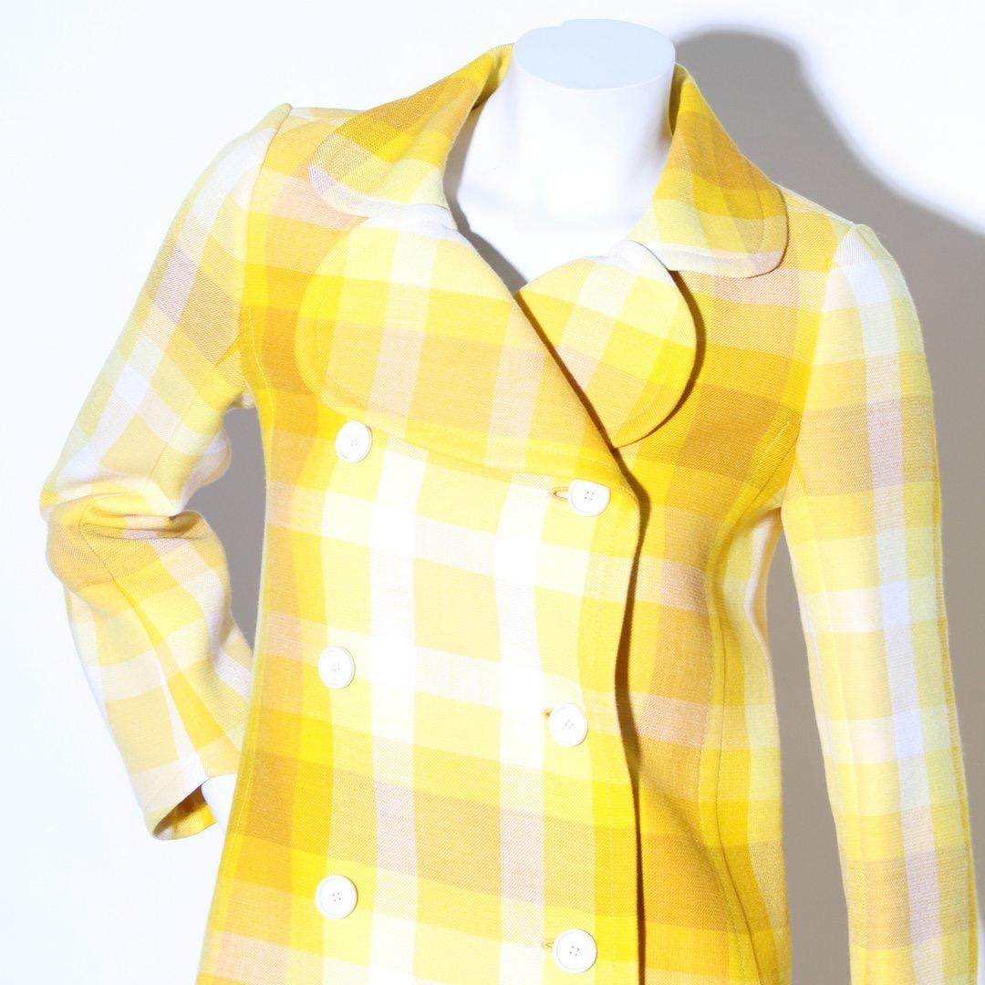 Product Details:
Yellow plaid jacket by Emanuel Ungaro 
Circa 1960's 
Plaid pattern 
Yellow tones 
Long sleeves
Button front closure with interior snap button 
Double breasted front 
Large collar 
Condition: Great vintage condition. small pulls in
