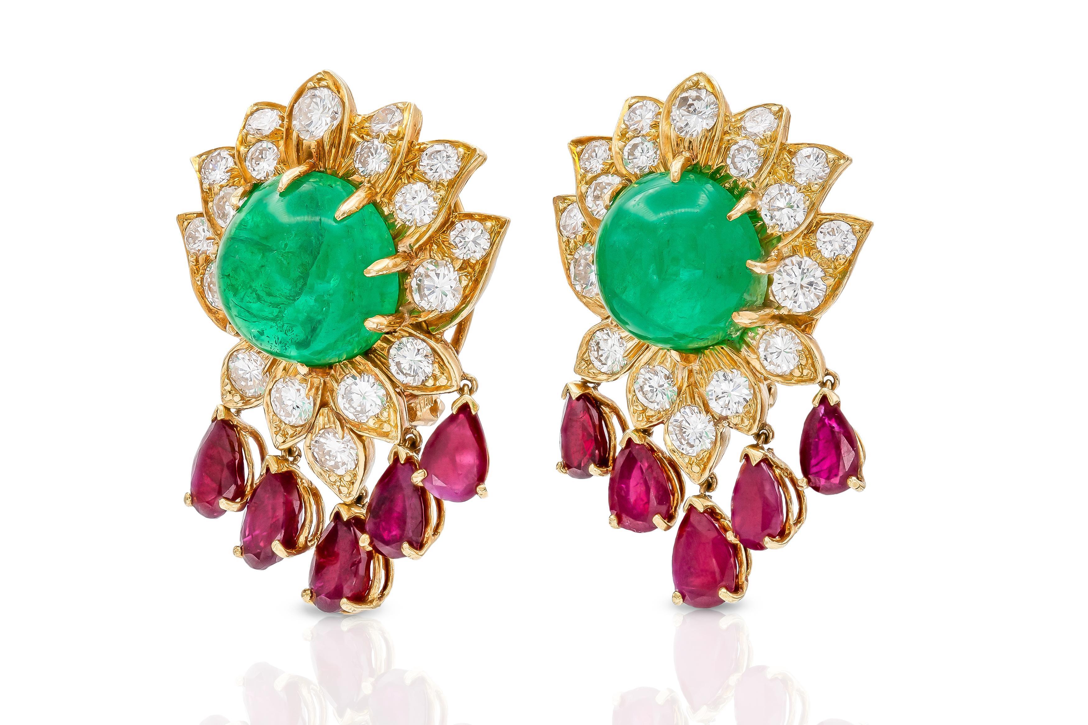 Finely crafted in 18k yellow gold with two Cabochon Emeralds weighing approximately a total of 12.00 carats, 10 Pear-Shaped Rubies weighing approximately a total of 3.00 carats, and Round Brilliant cut Diamonds weighing approximately a total of 5.50