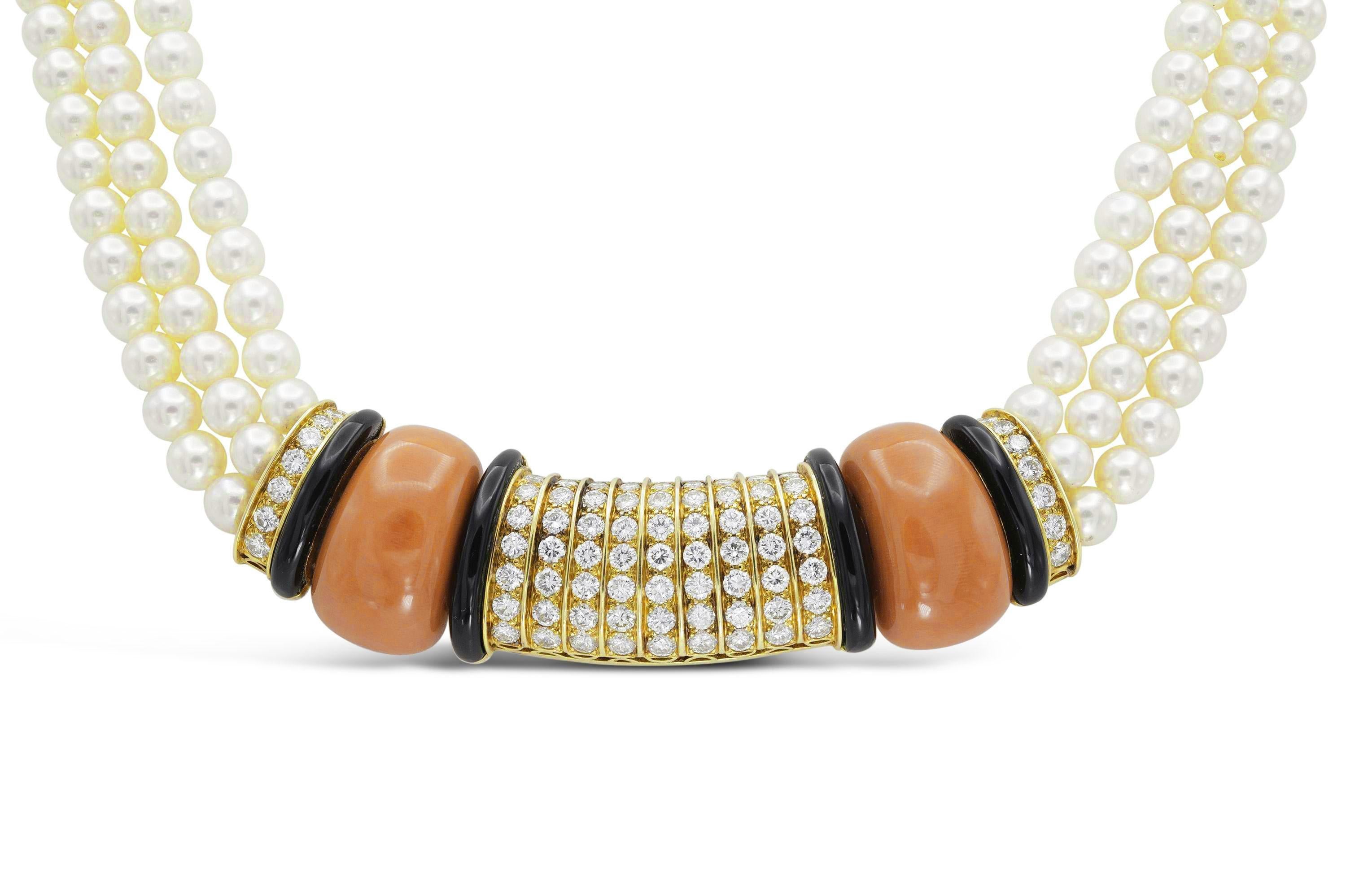 Finely crafted in 18k yellow gold with three strands of Pearls, Coral, Onyx, and Round Brilliant cut Diamonds weighing a total of approximately 6.00 carats.
Signed by Van Cleef & Arpels
Circa 1960s
15 1/2 inches long