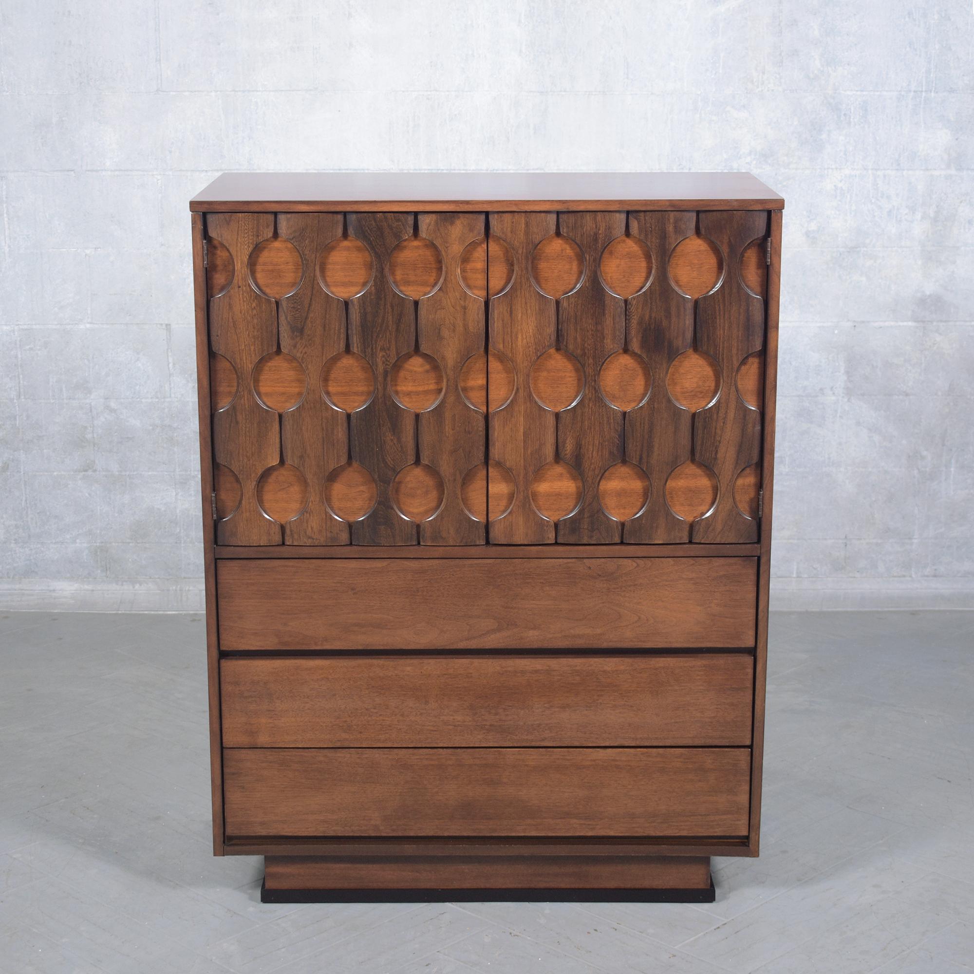 Discover this beautifully restored mid-century chest of drawers, crafted from premium walnut and brought to life by our expert craftsmen. This vintage 1960s dresser, in excellent condition, features a deep walnut stain under a protective satin