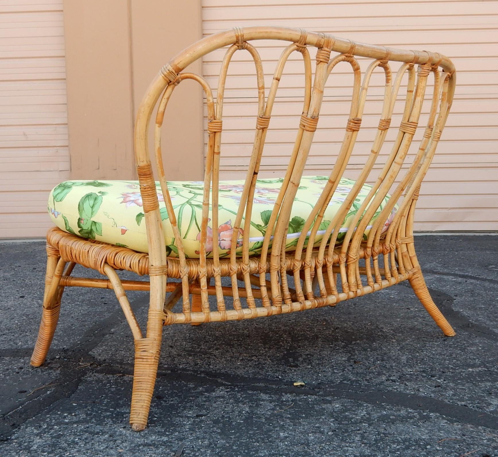 Wonderfully sculpted cane rattan lounge settee.
Circa 1960's. 
Newly refinished and upholstered in 1950's Cohama 