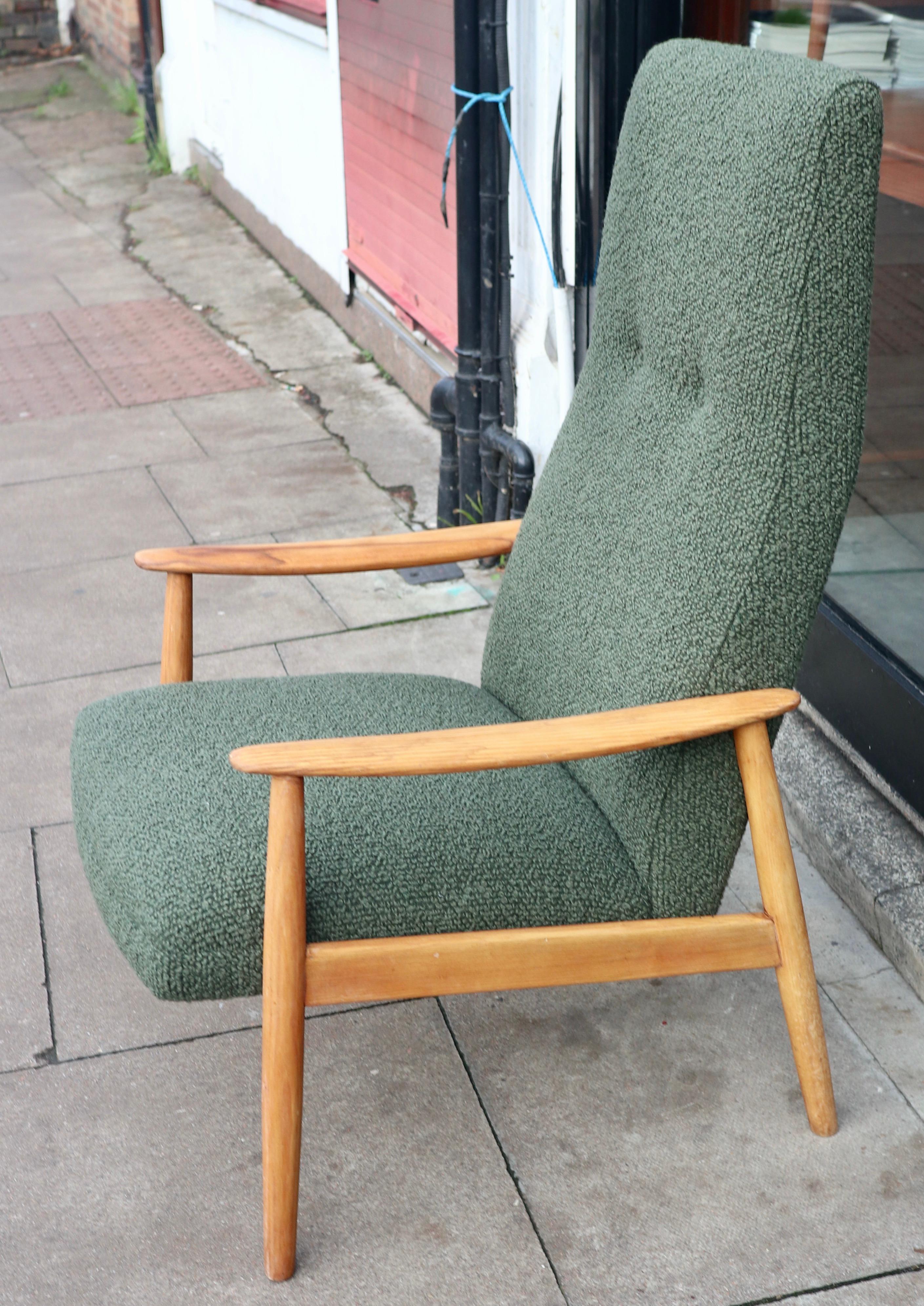 Vintage 1960s Danish high back lounge chair upholstered in moss green coloured boucle textile.  The chair has light coloured Elmwood arms that contrast  with the dark hue of the green fabric. All of the woodwork has been cleaned and refurbished,