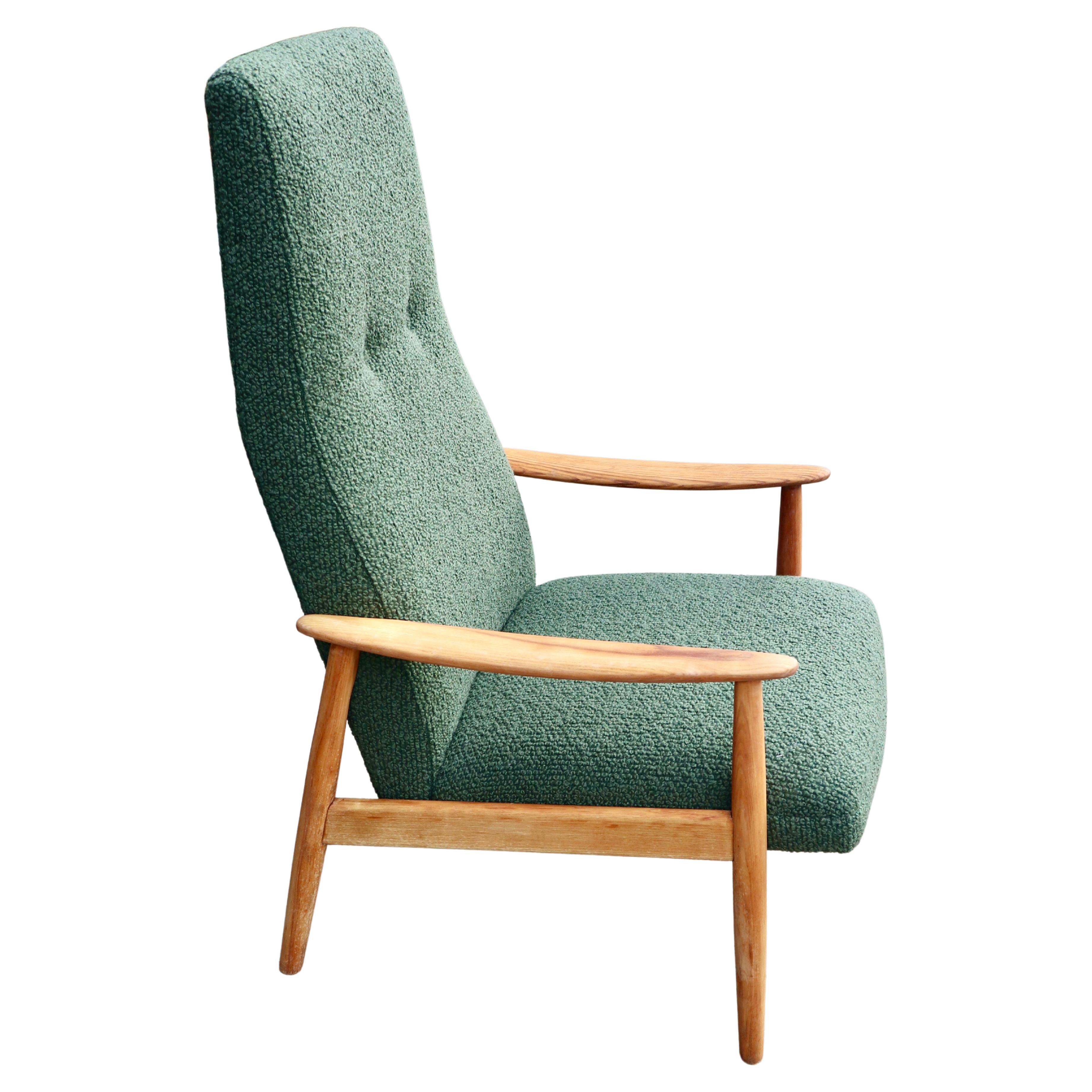 Vintage 1960s wood framed Danish lounge chair upholstered in moss green boucle.