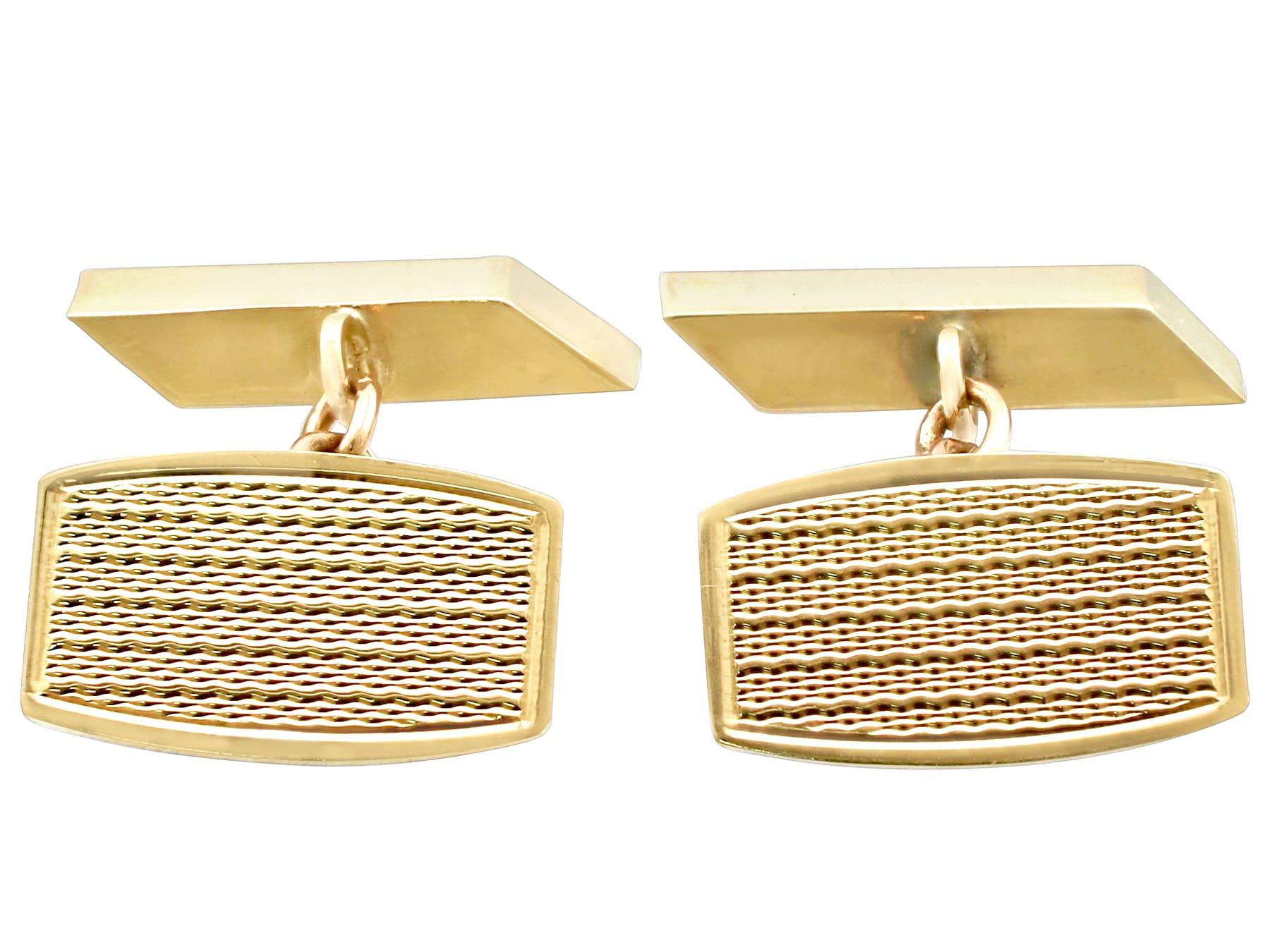 A fine pair of vintage English 9 karat yellow gold cufflinks; part of our men's jewelry and estate jewelry collections.

These fine vintage cufflinks have been crafted in 9k yellow gold.

The anterior link of these men's 9k gold cufflinks have a