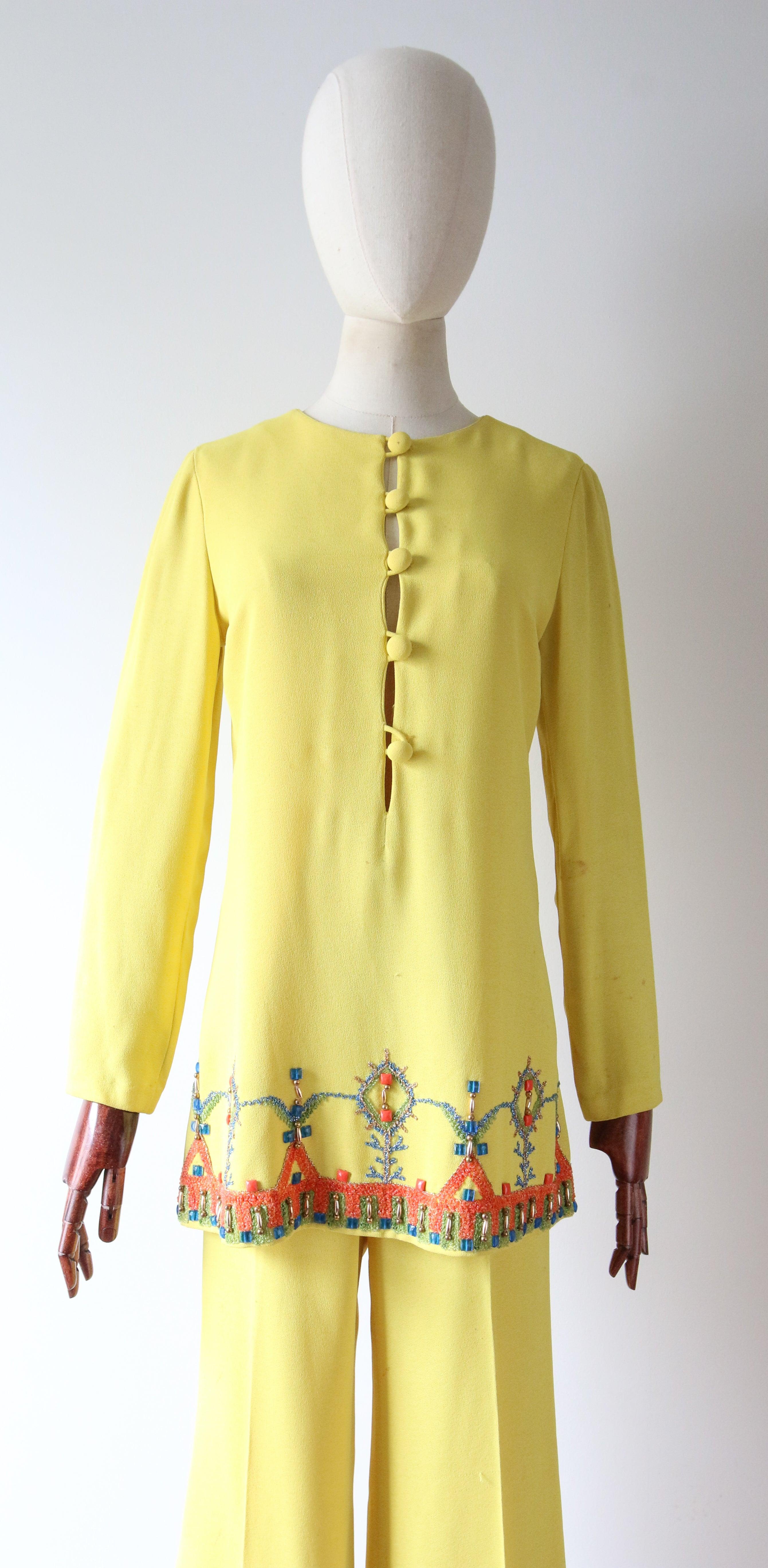 Rendered in the brightest shade of Sicilian yellow and accented by turquoise, orange and gold beadwork, with green, turquoise, gold and orange raffia embroidery, this truly wonderful 1960's tunic and trouser set, is the perfect set to add to your