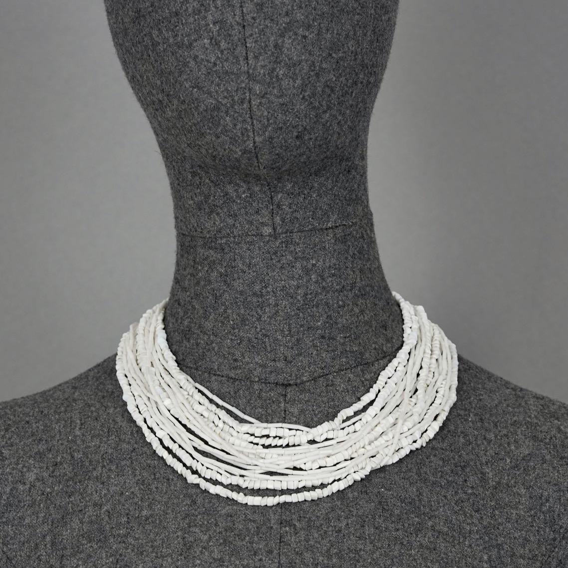 Vintage 1965 CHRISTIAN DIOR Multi Strand Milk Glass Beads Necklace

Measurements:
Height Drop: 2.75 inches (7 cm)
Wearable Length: 16.92 inches (43 cm)

Features:
- 100% authentic CHRISTIAN DIOR.
- Multi strand milk glass beads.
- Box clasp