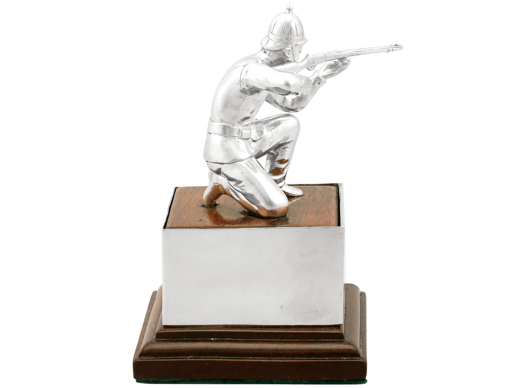 A fine vintage Elizabeth II English cast sterling silver presentation trophy on oakwood plinth in the form of a Victorian soldier; an addition to our military related silverware collection.

This fine vintage Elizabeth II English cast sterling
