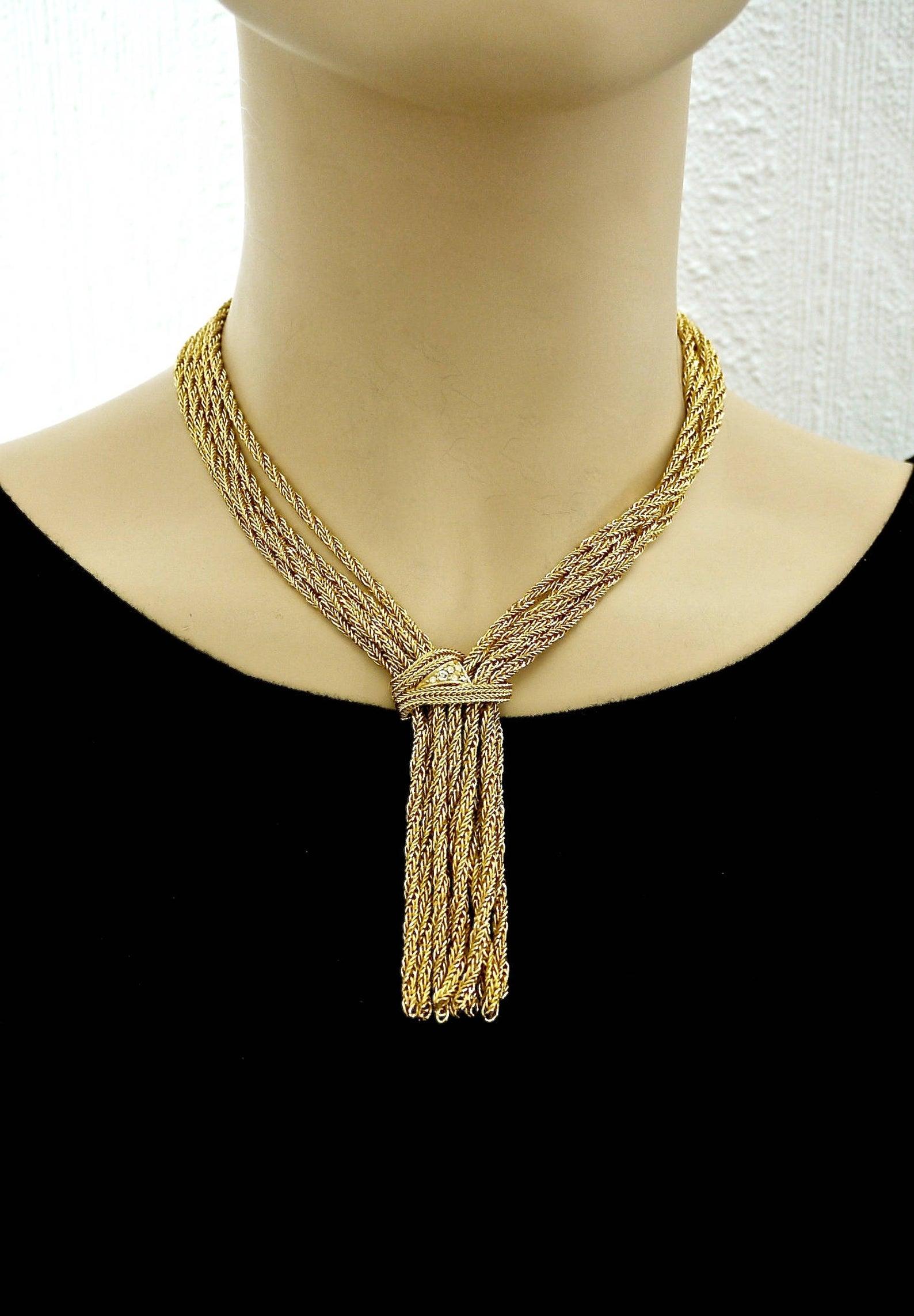 Vintage 1967 CHRISTIAN DIOR Cascading Multi Chain Rhinestone Tassel Necklace

Measurements:
Pendant Height: 3.35 inches (8.5 cm)
Wearable Length: 16.7 inches (42.5 cm)

Features:
- 100% Authentic CHRISTIAN DIOR.
- 5 twisted chains on each side