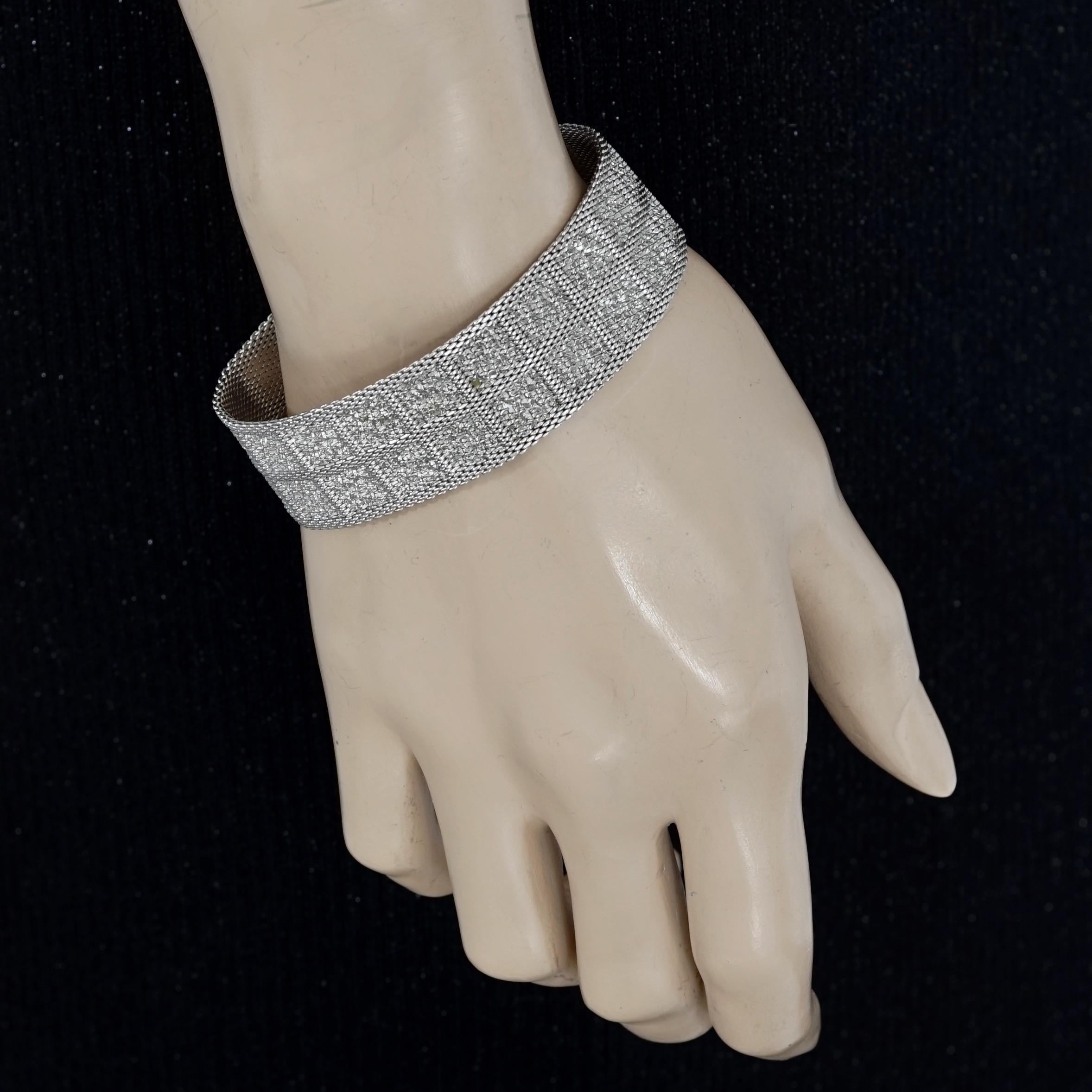 Vintage 1967 CHRISTIAN DIOR Mesh Silver Bracelet

Measurements:
Height: 0.82 inch (2.1 cm)
Wearable Length: 7.36 inches (18.7 cm)

Features:
- 100% Authentic CHRISTIAN DIOR.
- Mesh bracelet with hammered detailing.
- Silver tone.
- Signed 1967 CHR