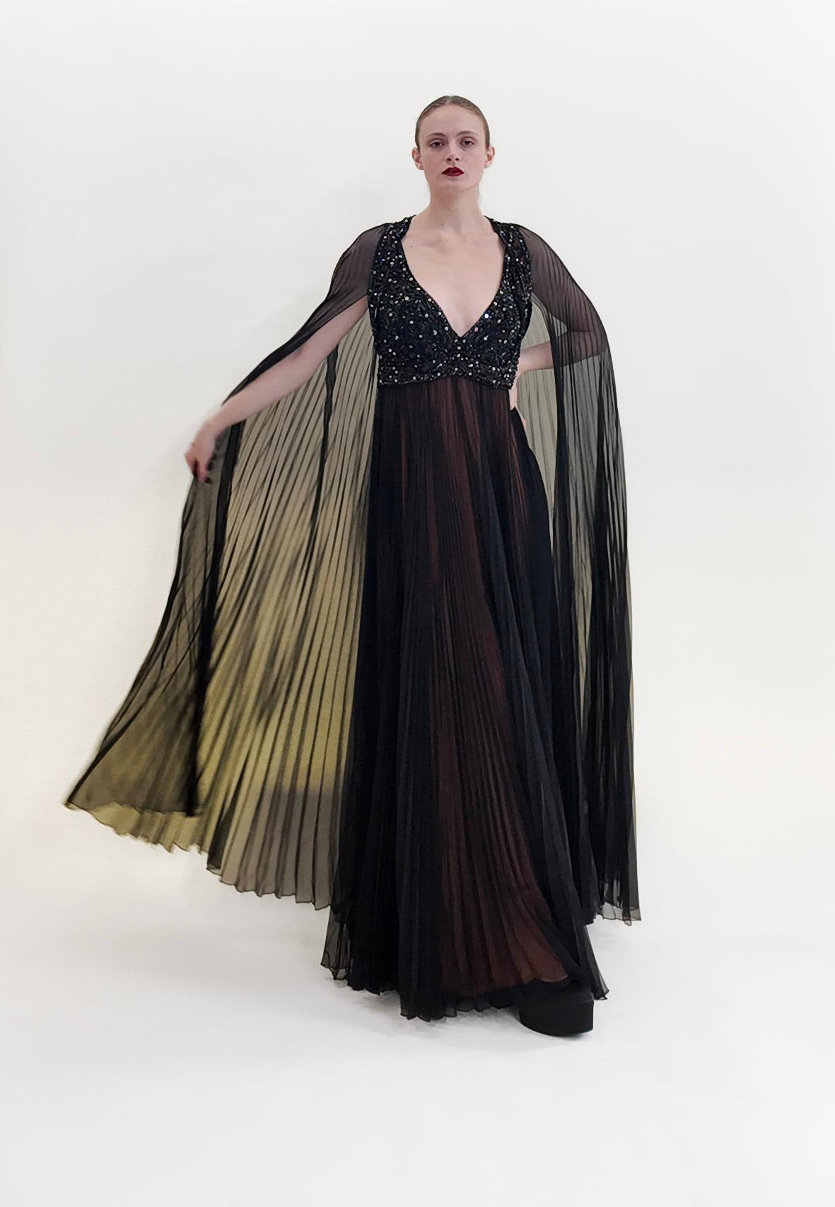 Worn by actress Lainie Kazan in 1969, this gown with its detachable cape was famously worn by her in the October 1970 issue of Playboy. Originally created for the iconic Elizabeth the First store, this gown was a collaborative effort between Bob