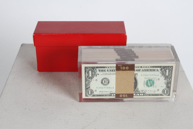 This vintage 1969 pop art illusion Lucite sculpture that has what appears to be a five stacks of $100.00 banded $1 dollar bills inside... It is as if the bank banded these together to with five $100.00 each bands for a total of $500 and then a