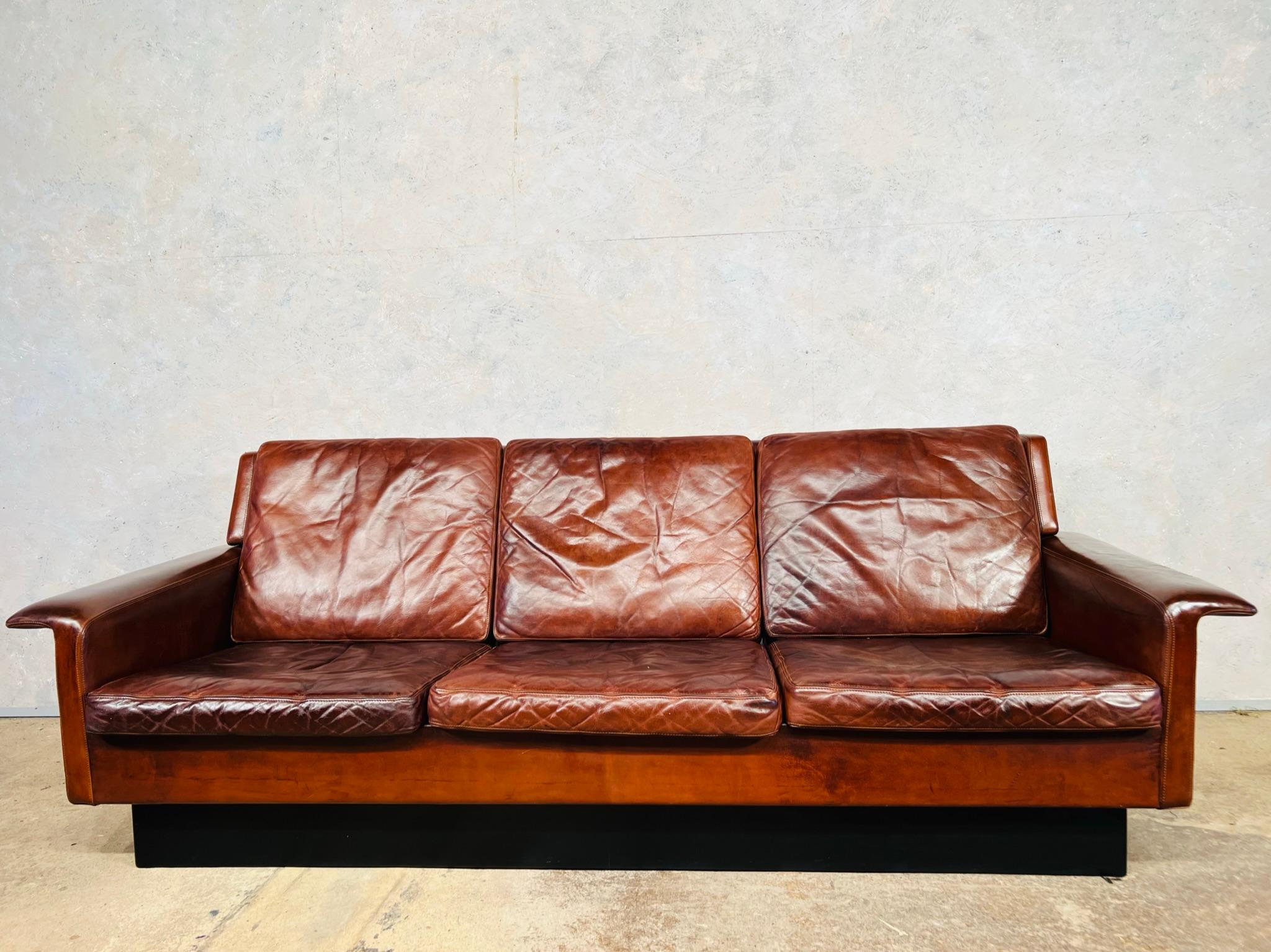 An Original Arne Vodder Three Seater Brown Leather Sofa For Fritz Hansen 1960.

Very stylish timeless design with a beautiful shape and great lines, the sofa sits beautifully and elegantly. The original leather has a beautiful patina.

Arne Vodder