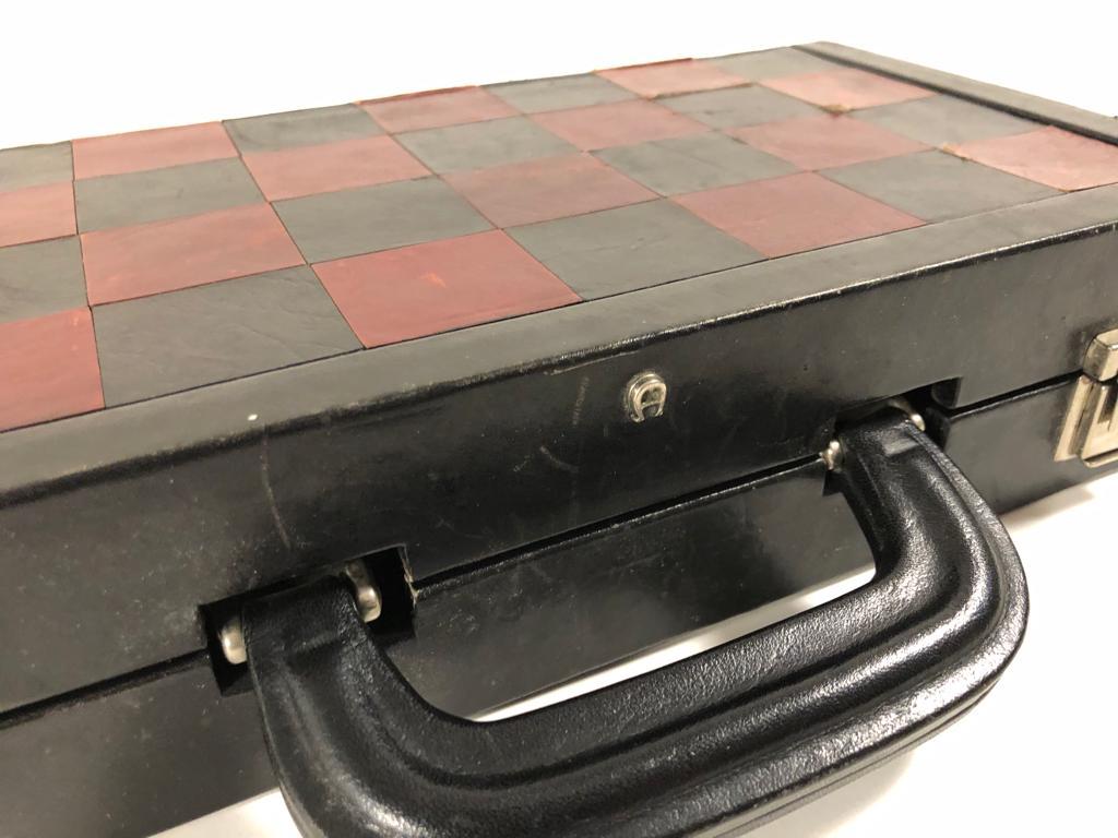 Vintage 1970 backgammon & chess rare Etienne Aigner black and burgundy handmade soft leather complete set a rare find since they were just a few made guaranteeing the maximum level of craftsmanship and luxury. 
The case is has visible distress on
