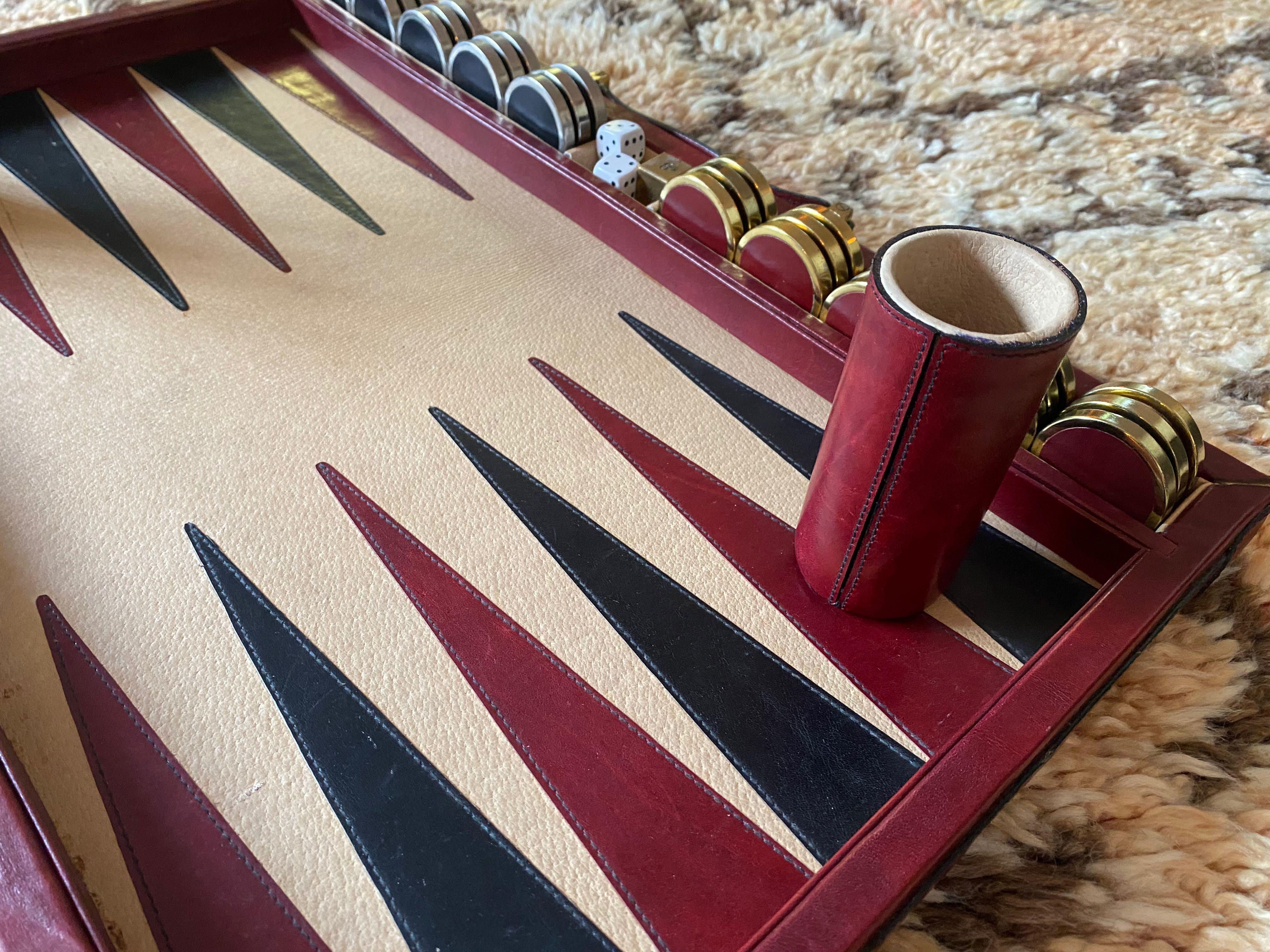 Gently played, vintage 1970 backgammon rare Etienne Aigner burgundy handmade soft leather set as pictured.
A rare find since they were just a few made guaranteeing the maximum level of craftsmanship and luxury. 
The case has minor distress on the