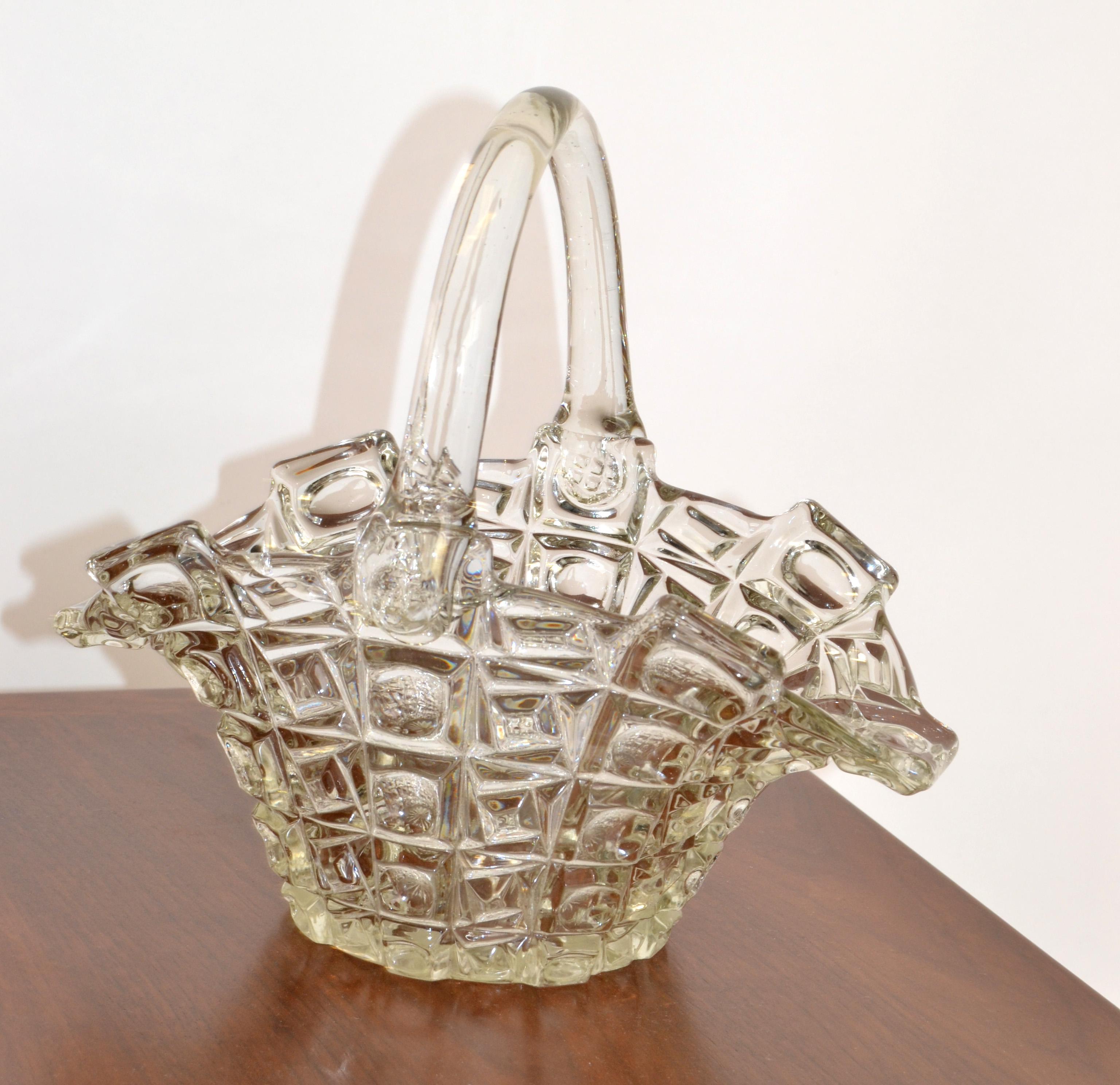 Vintage 1970s transparent crystal glass basket with Handle for a Bride, Flowers, Fruit or as a Centerpiece with Your favorite Snacks.
In all very good condition.