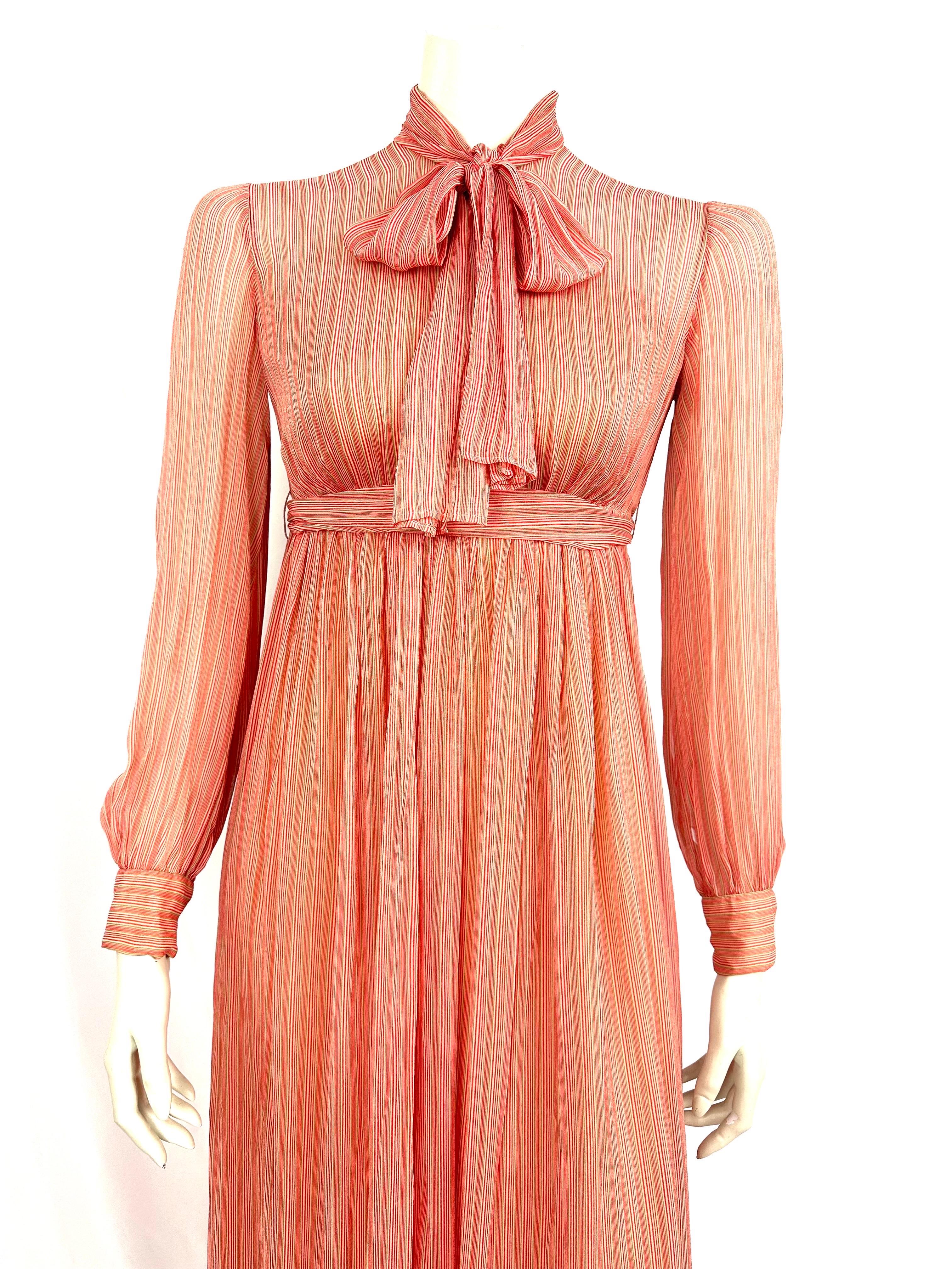 Maxi silk chiffon dress Jean Patou, 
 fine stripes in coral tones.
Removable underdress.
Long back zipper
Ties at waist and lavallière collar.
Missing size and composition labels.
Estimated size 34, please refer to measurements
Shoulder 32cm
Chest