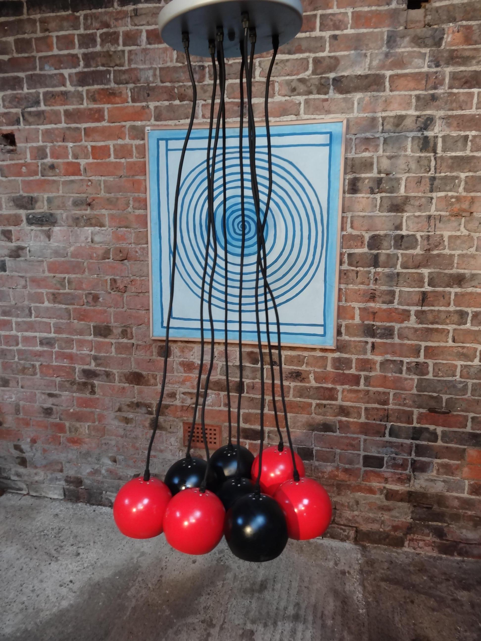 Vintage 1970 super retro metal 8 ball black and red ceiling light, each light can be hanging from the ceiling on a different level and distance from the center to make a great light effect. 

Measures: Height 120cm, depth 50cm, width 50cm.