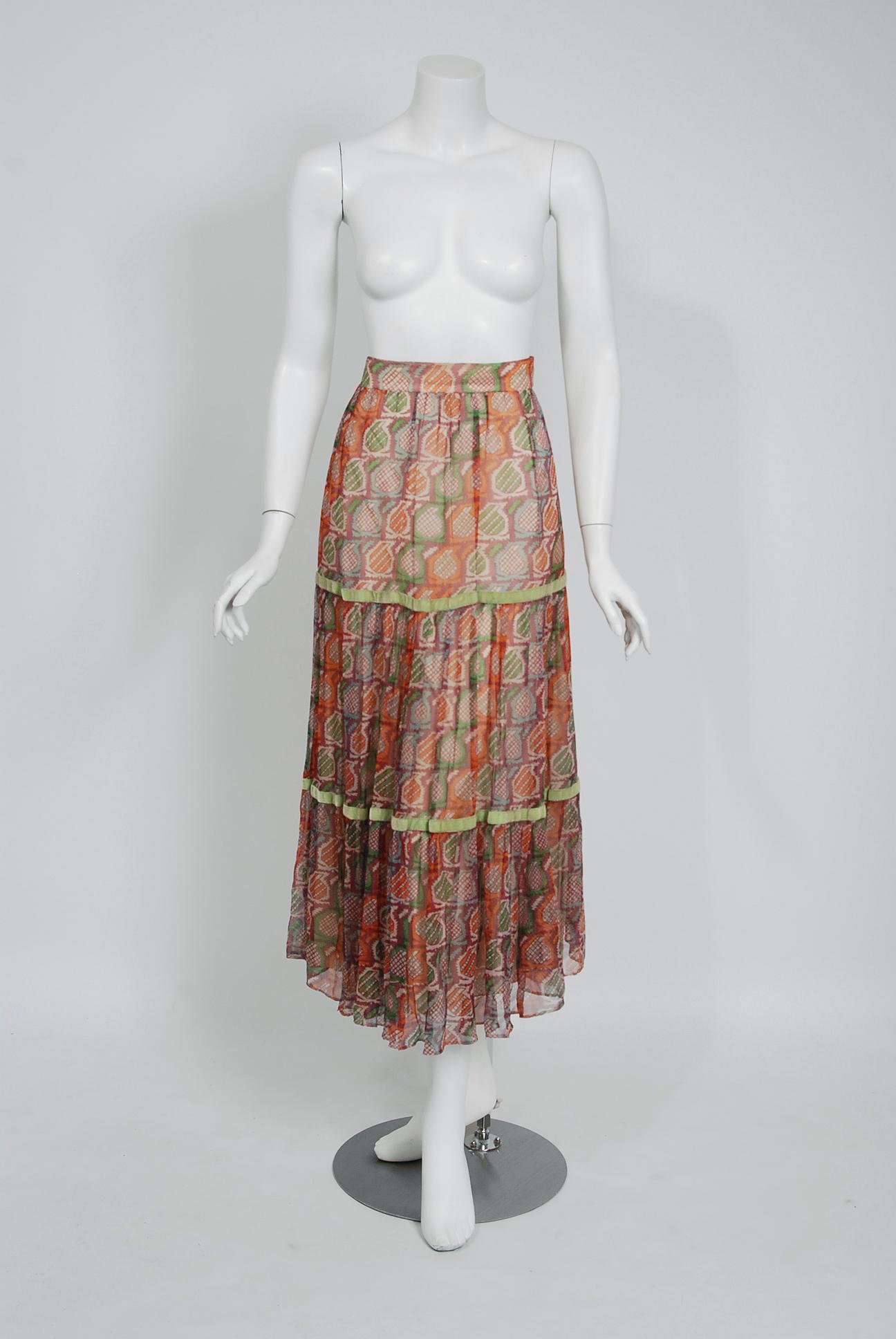 Gorgeous Thea Porter Couture designer skirt fashioned in luxurious multi-colored silk chiffon. Just look at the beautiful bohemian print. I love the nipped waist and detailed green velvet piping. Thea Porter was largely inspired by fashion from