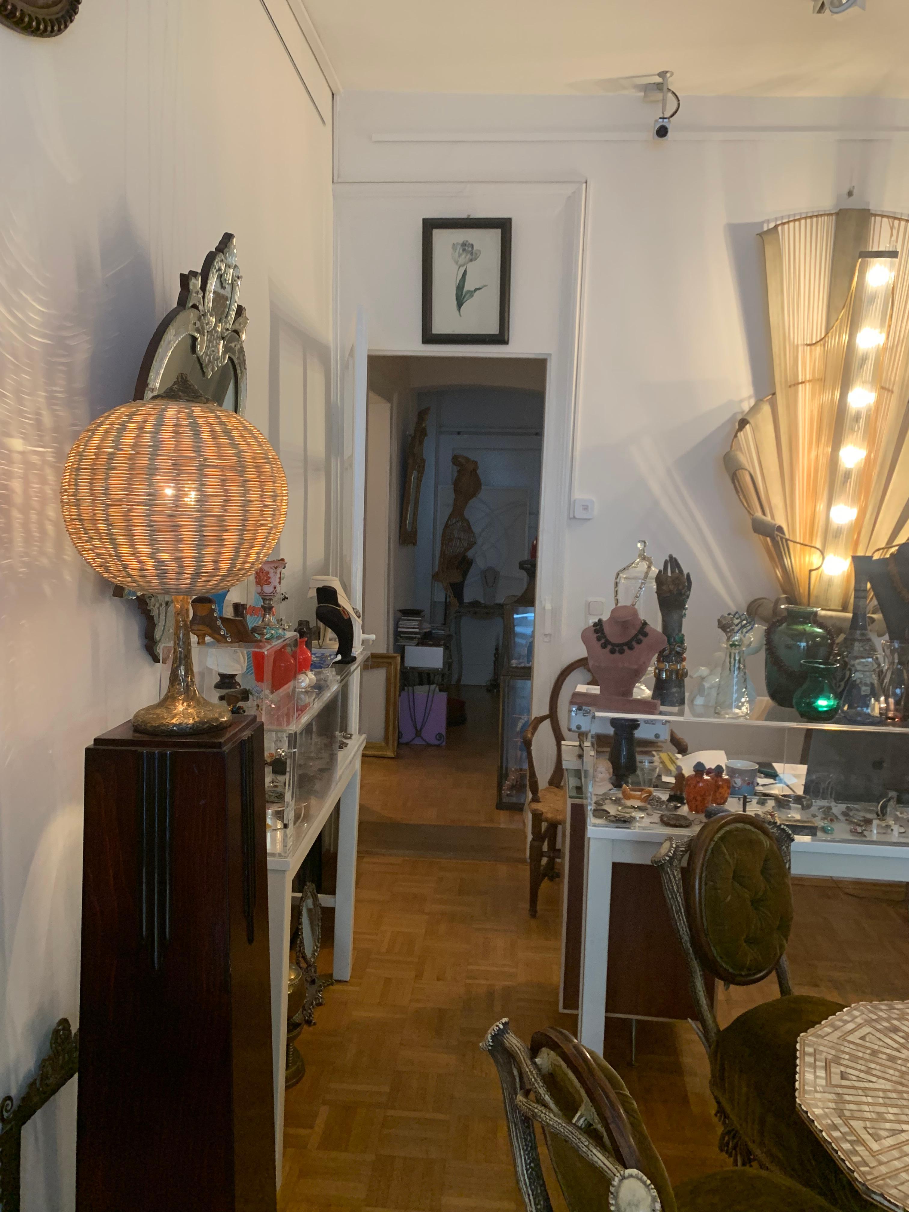 This lamp has very good proportions. The bronze lamp foot is heavy and assures a good stand.
The bronze foot is signed, Rozzaro, Bozzaro... and was cast from a hand made model. It is fitted with wicker ball lamp shade, presumably it is the original