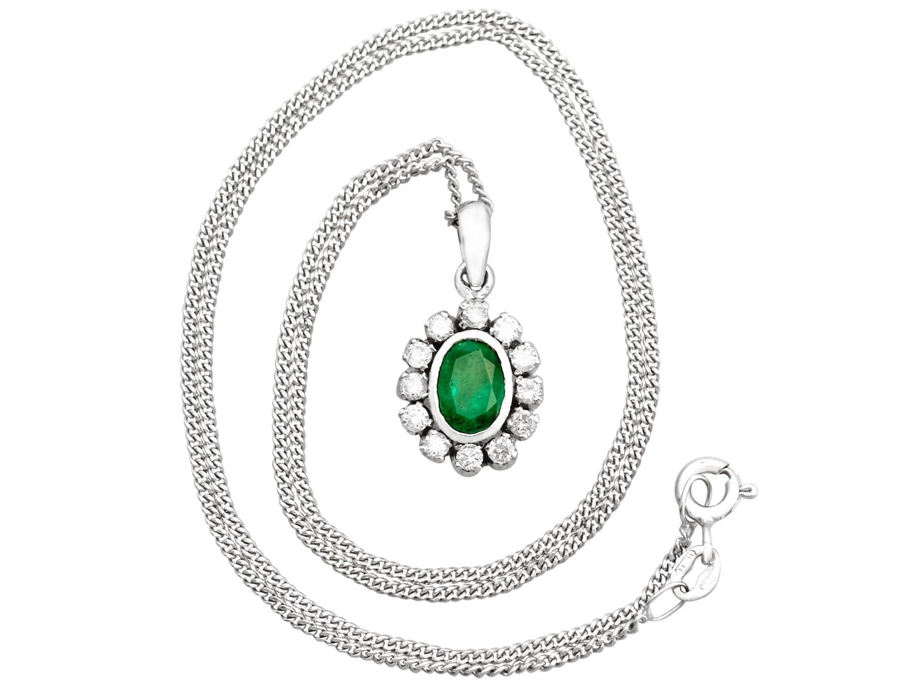 A fine and impressive 1.02 carat emerald and 0.48 carat diamond, 18 karat white gold cluster pendant; part of our diverse vintage jewelry collections.

This fine and impressive vintage emerald and diamond pendant has been crafted in 18k white