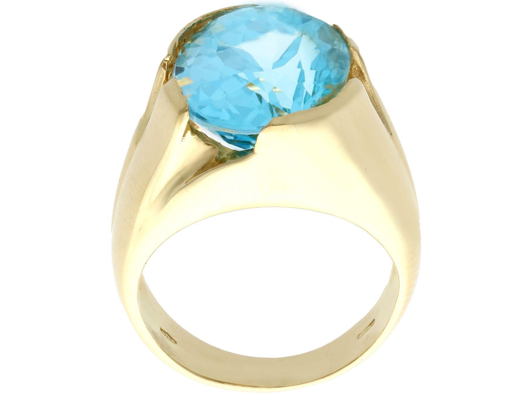 A stunning, fine and impressive vintage 14.12 carat blue topaz, 18k yellow gold cocktail ring; part of our diverse gemstone jewelry collection.

This stunning large blue oval cut topaz dress ring has been crafted in 18k  yellow gold.

The feature