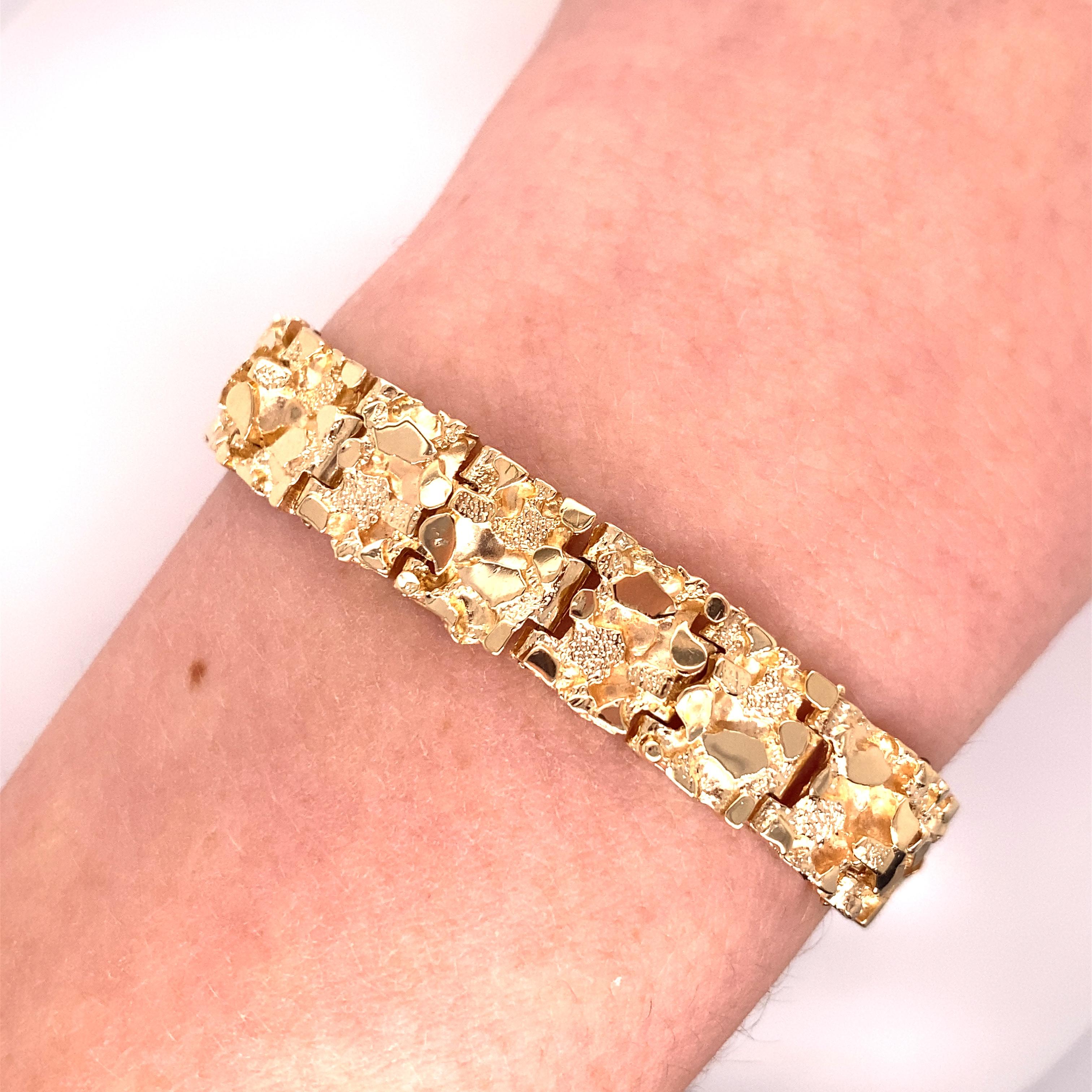 Vintage 1970's 14K Yellow Gold Nugget Bracelet - The bracelet measures .4 inches wide and 7 inches long. It has a plunger clasp with a figure 8 safety catch. The bracelet weighs 32 grams.