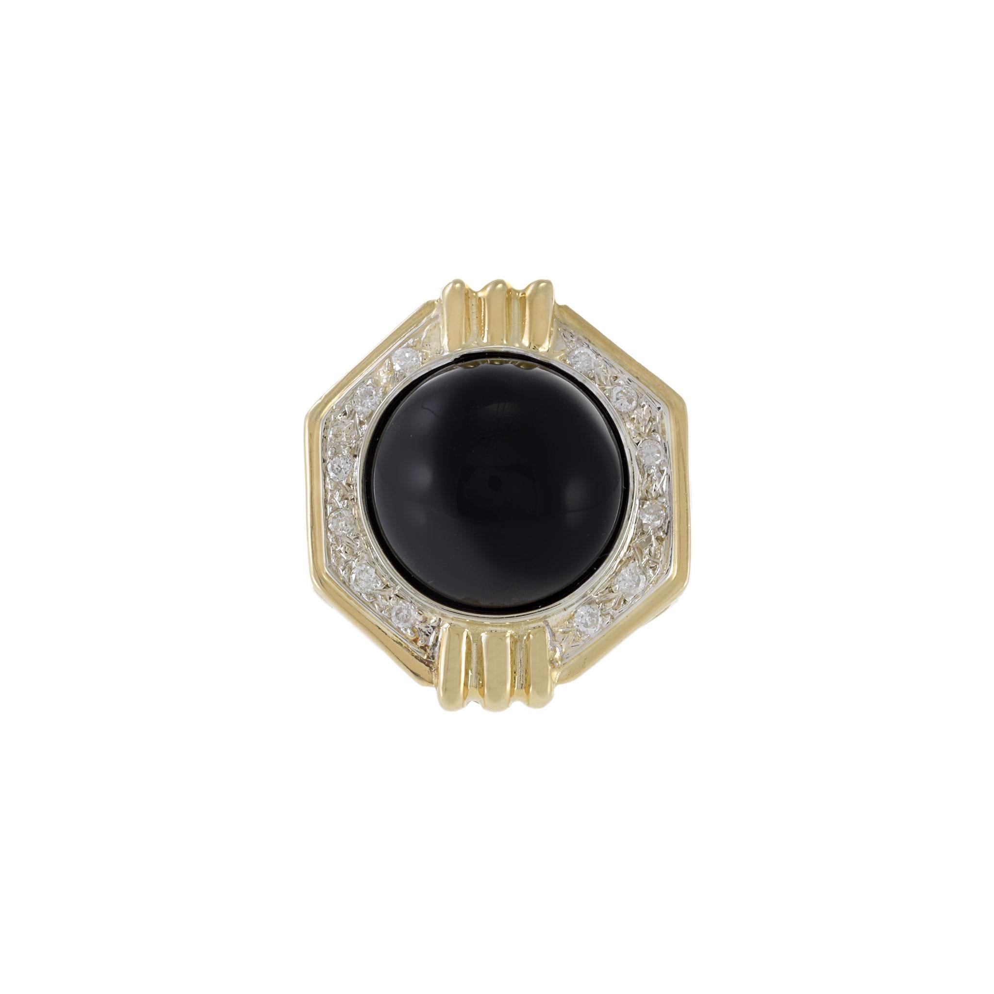 Made with 14KT yellow gold and adorned with beautiful diamonds and black onyx, this vintage ring is the perfect accessory for any special occasion. With a design that captures the essence of the 1970s, this ring offers a timeless and elegant style