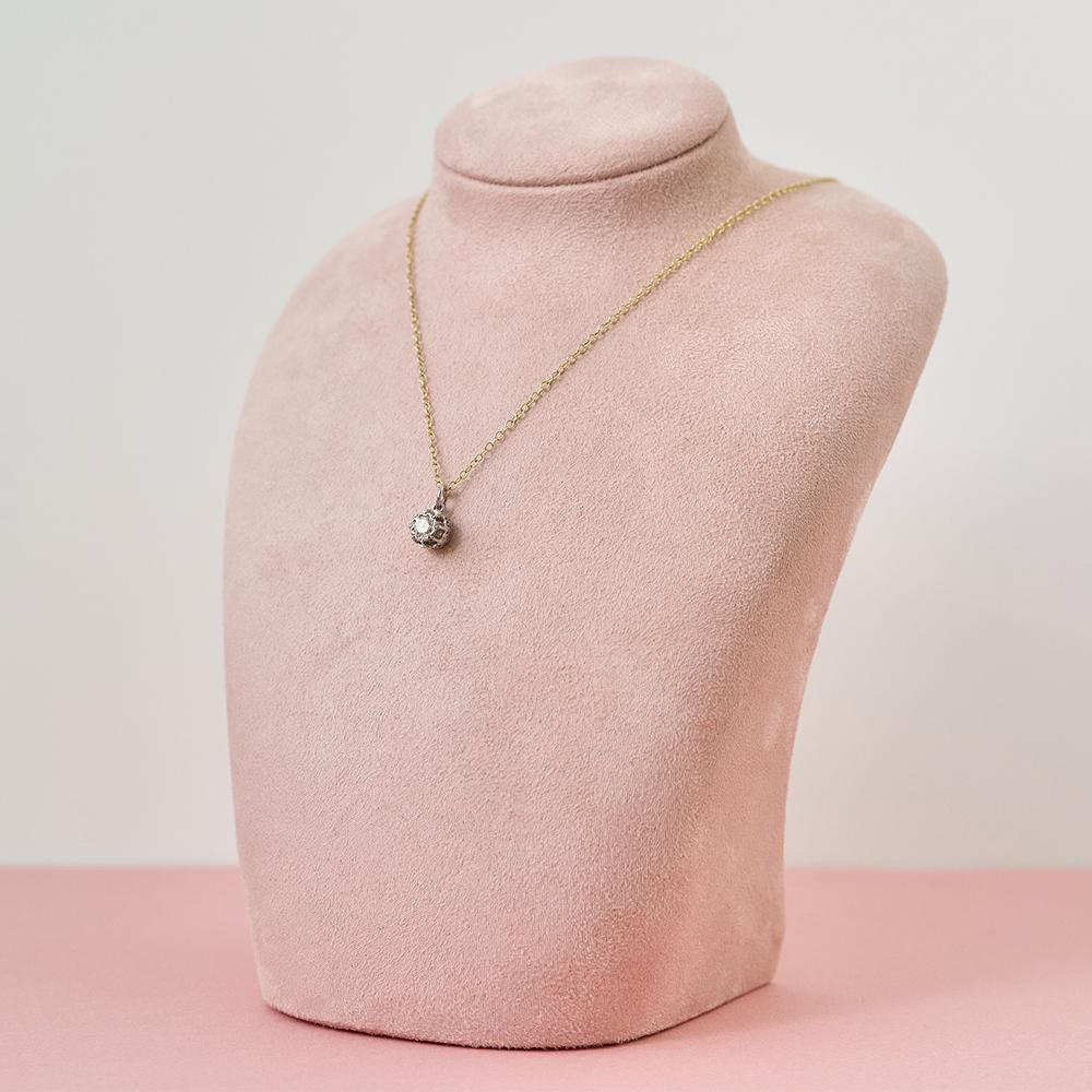 Step back in time with our Vintage 1970s 18ct Gold Diamond Pendant Necklace, a stunning piece that encapsulates the bold spirit of the era. This unique pendant, originally crafted as a ring, has been reimagined into a breathtaking necklace. It
