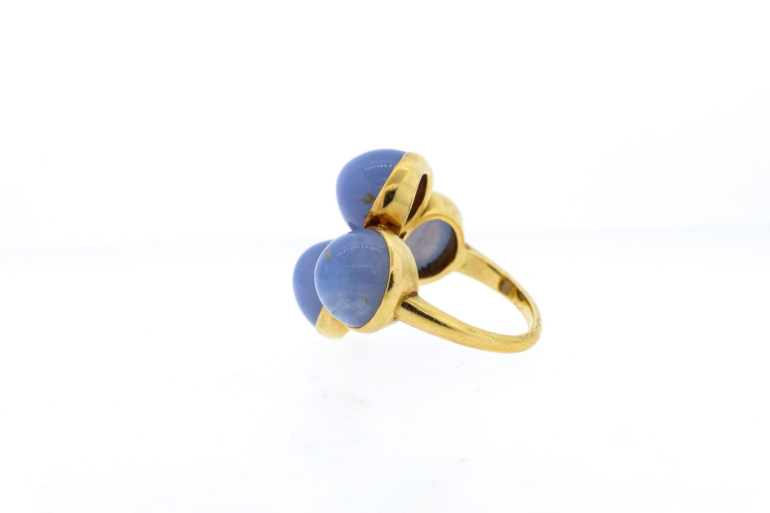 A vintage 18k yellow gold Cartier ring set with cabochon chalcedony, circa 1970. The ring is a true funky design for an unusual cocktail ring. The ring is signed Cartier London, where they often created avant- garde designs to reflect modern styles.