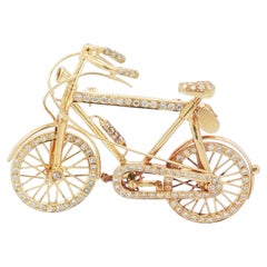 Vintage 1970s 18K Gold, Diamond, and Ruby Bicycle Brooch with Articulated Wheels