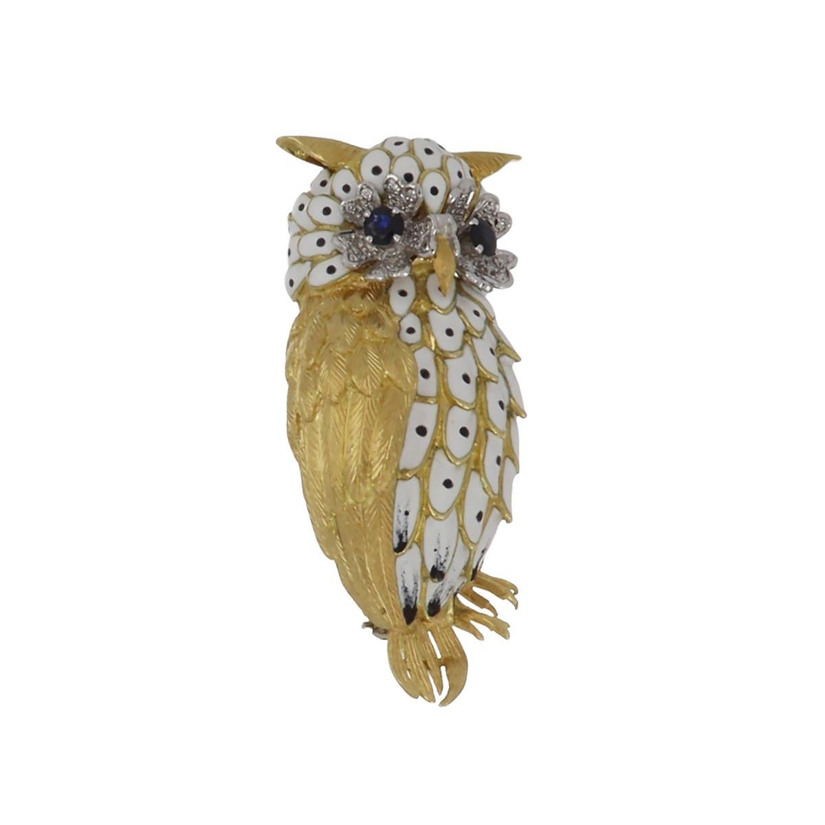 Vintage 18K two-tone gold owl brooch featuring white enamel with round sapphire eyes and round brilliant-cut diamond accents. The blue sapphires total 0.55 carats, and the diamonds total 0.60 carats, I-J color, VS1-VS2 clarity.  Circa 1970.