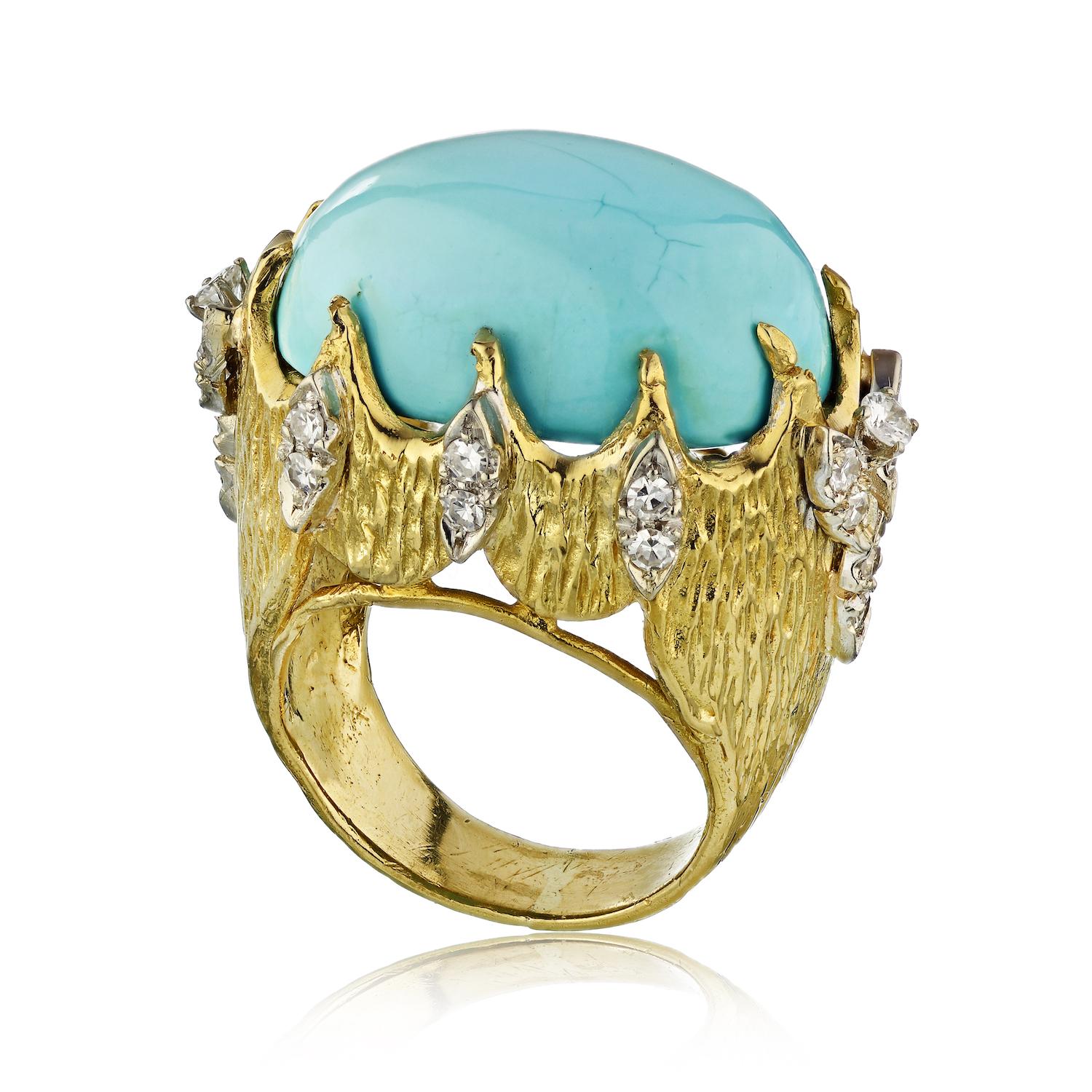 Beautiful 1970's ring crafted in 18k yellow gold set with dome oval turquoise gem. 
26 diamonds on the outer frame.

Gems: Turquoise, Diamonds
Metal Type: 18K Yellow Gold
Metal Weight: 21.0 gr.

Ring Size 6.5

ABOUT TURQUOISE:
Turquoise is an