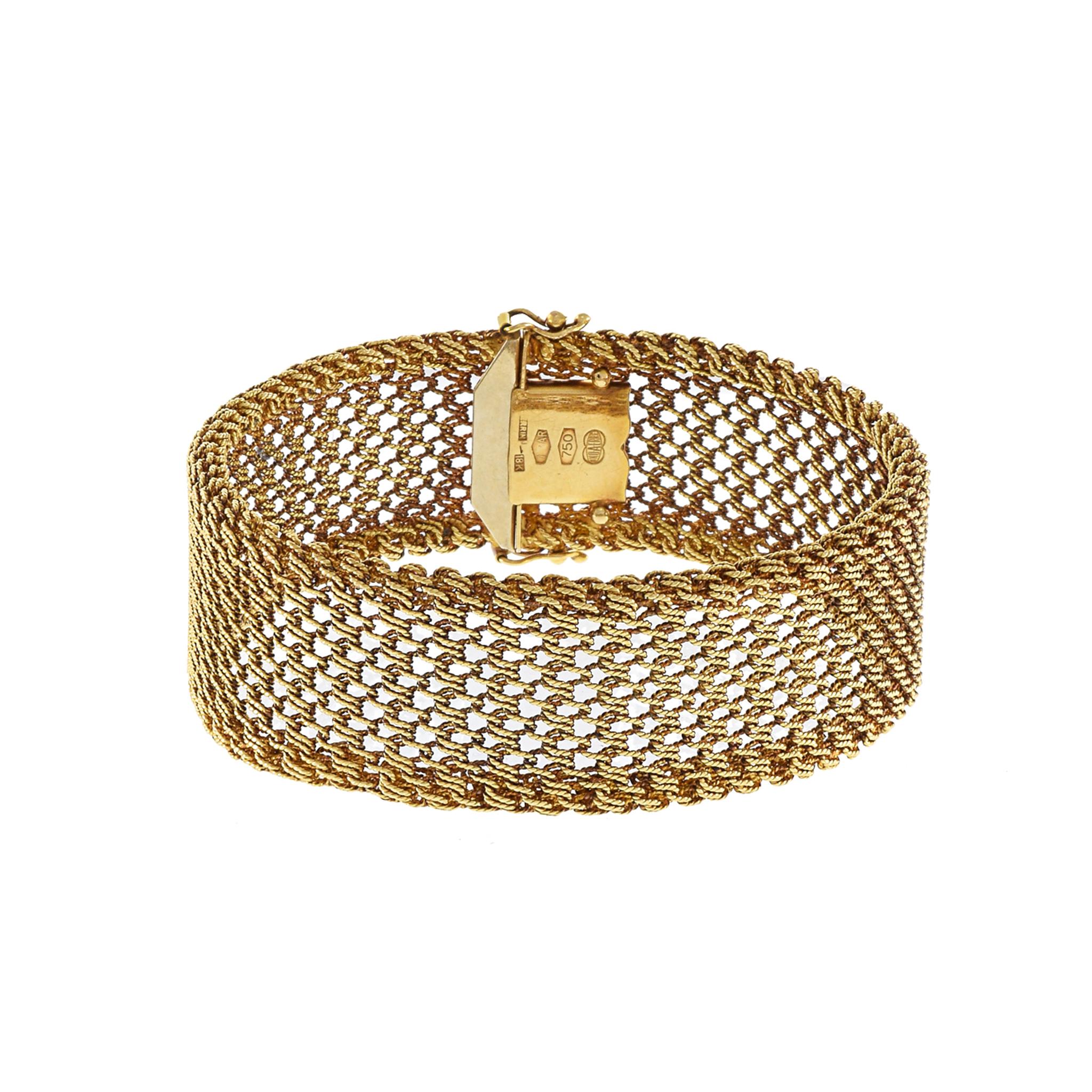 Vintage 1970's 18KT Yellow Gold wide Mesh Bracelet. Weighing 26.22 grams Indulge in the timeless sophistication of this Vintage 1970's 18KT Yellow Gold Mesh Bracelet. Crafted with luxurious 18KT gold and boasting a substantial weight of 26.22 grams,