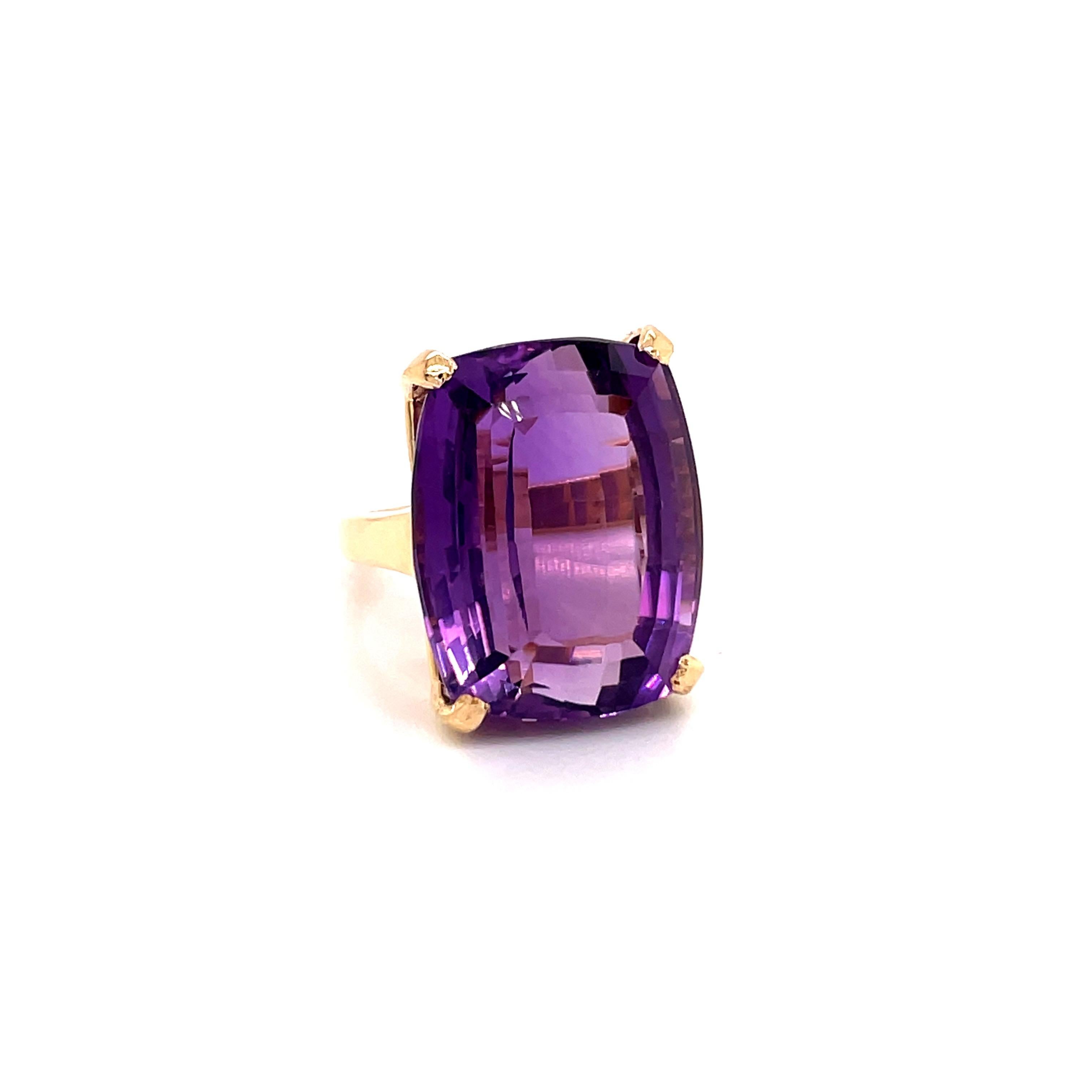 Vintage 1970's 35ct Cushion Cut Amethyst Ring - The amethyst weighs approximately 35ct and measures 23 x 18mm.  The setting is 14k yellow gold with a finger size 6.5 which can be sized upon request.  The ring weighs 17.6 grams