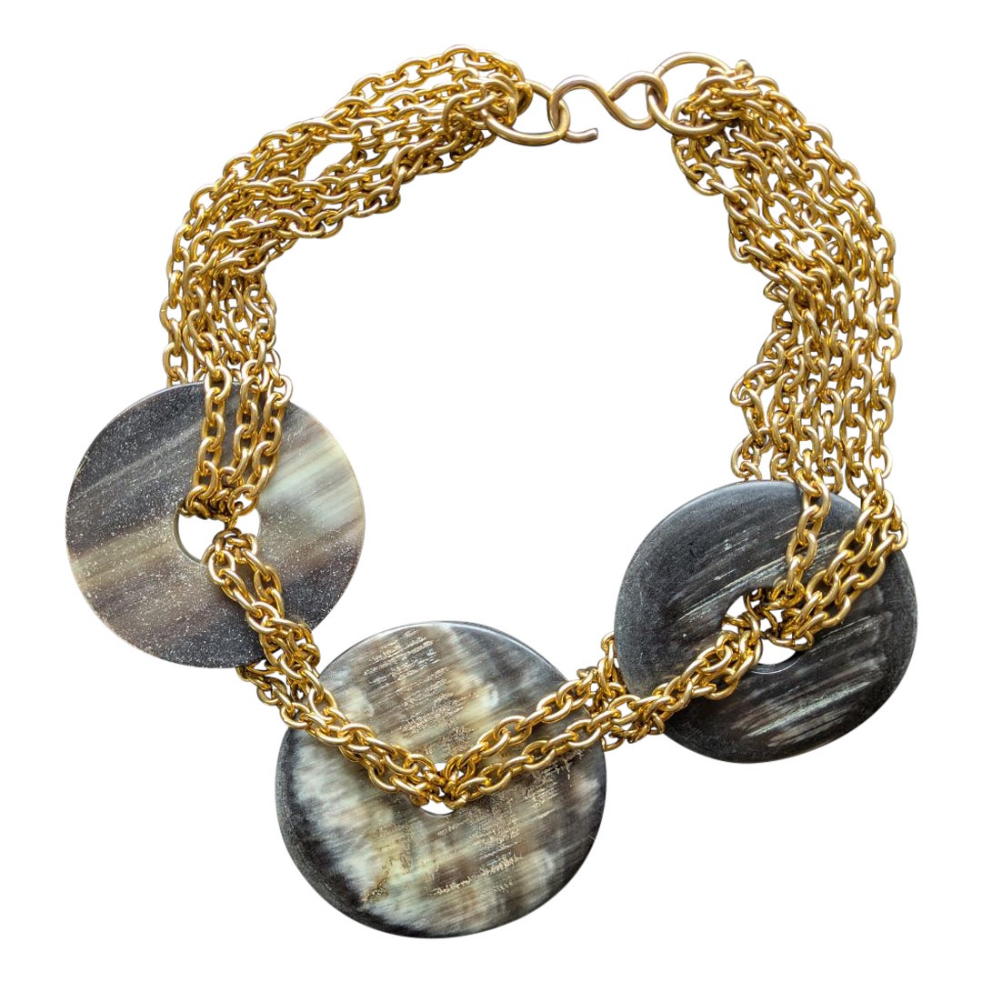 Collana vintage degli anni '70/'80 in metallo dorato e triplo anello di Horn