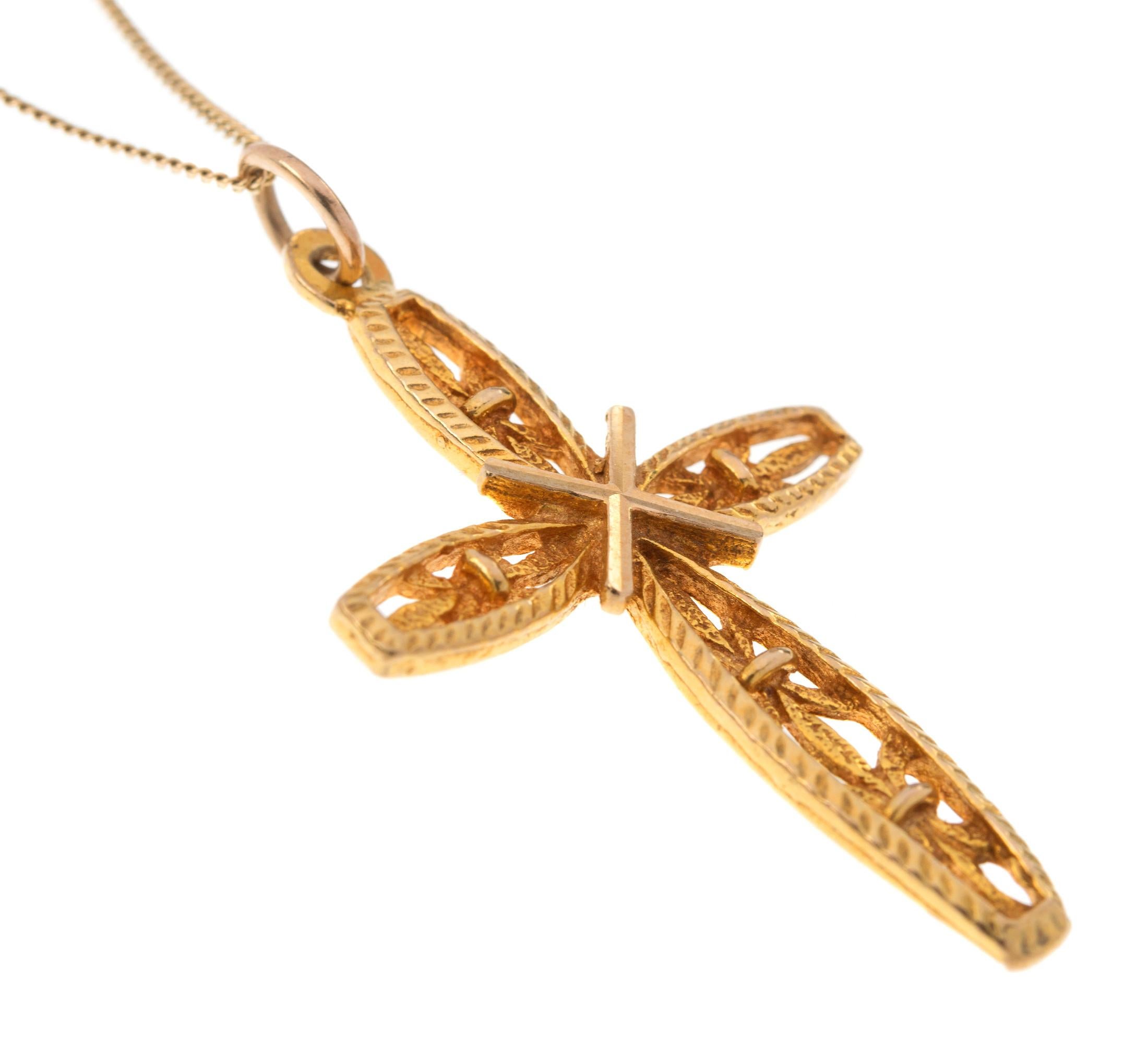 This is a lovely piece, with a central cross and gorgeous openwork floral detail.

A gorgeous golden adornment that can be worn all year round, making it the perfect gift for someone special.

Please note: The chain is not included.. please see our