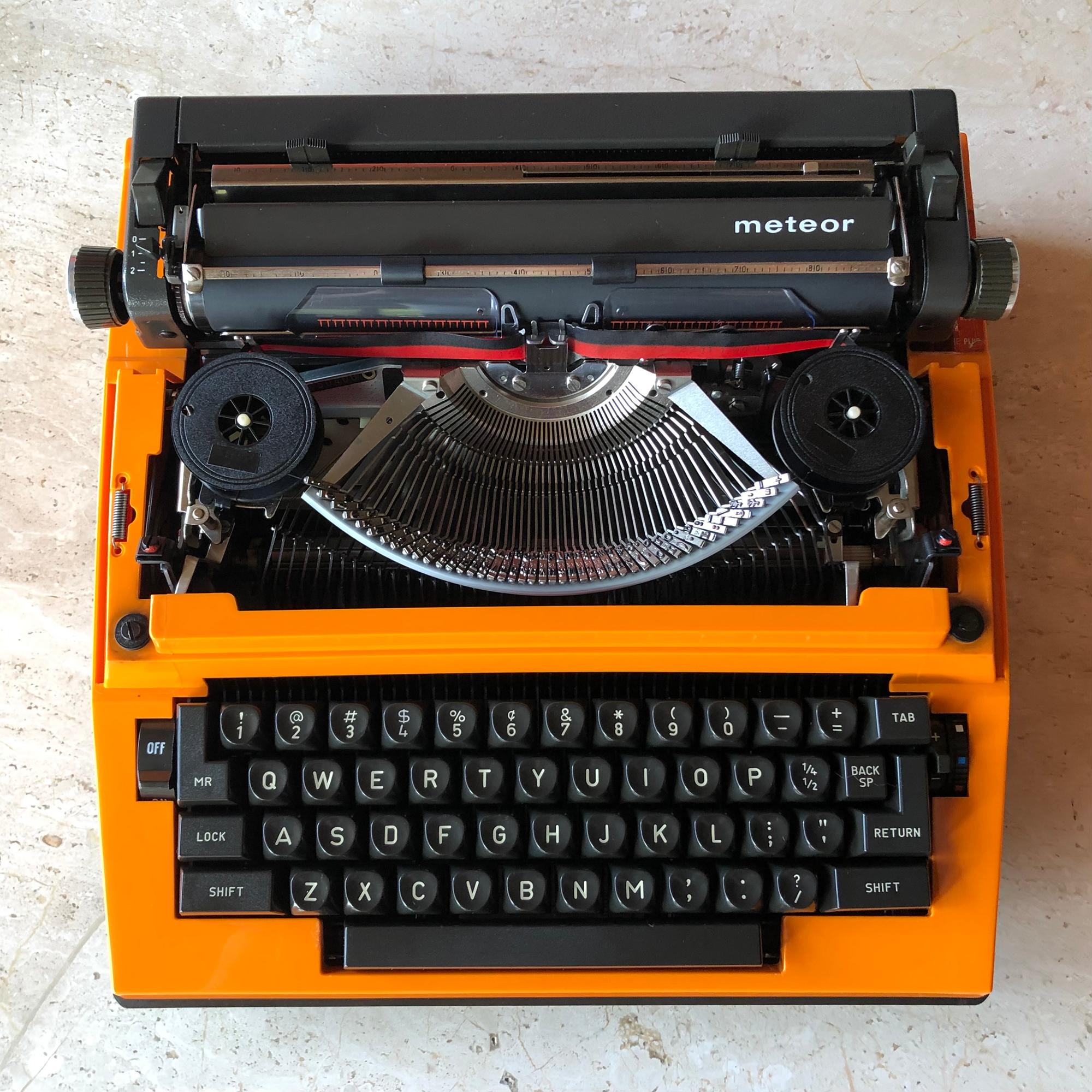 Vintage Adler Meteor electric typewriter with original case and cord. Made in Germany. Total overall measurement is 13.5