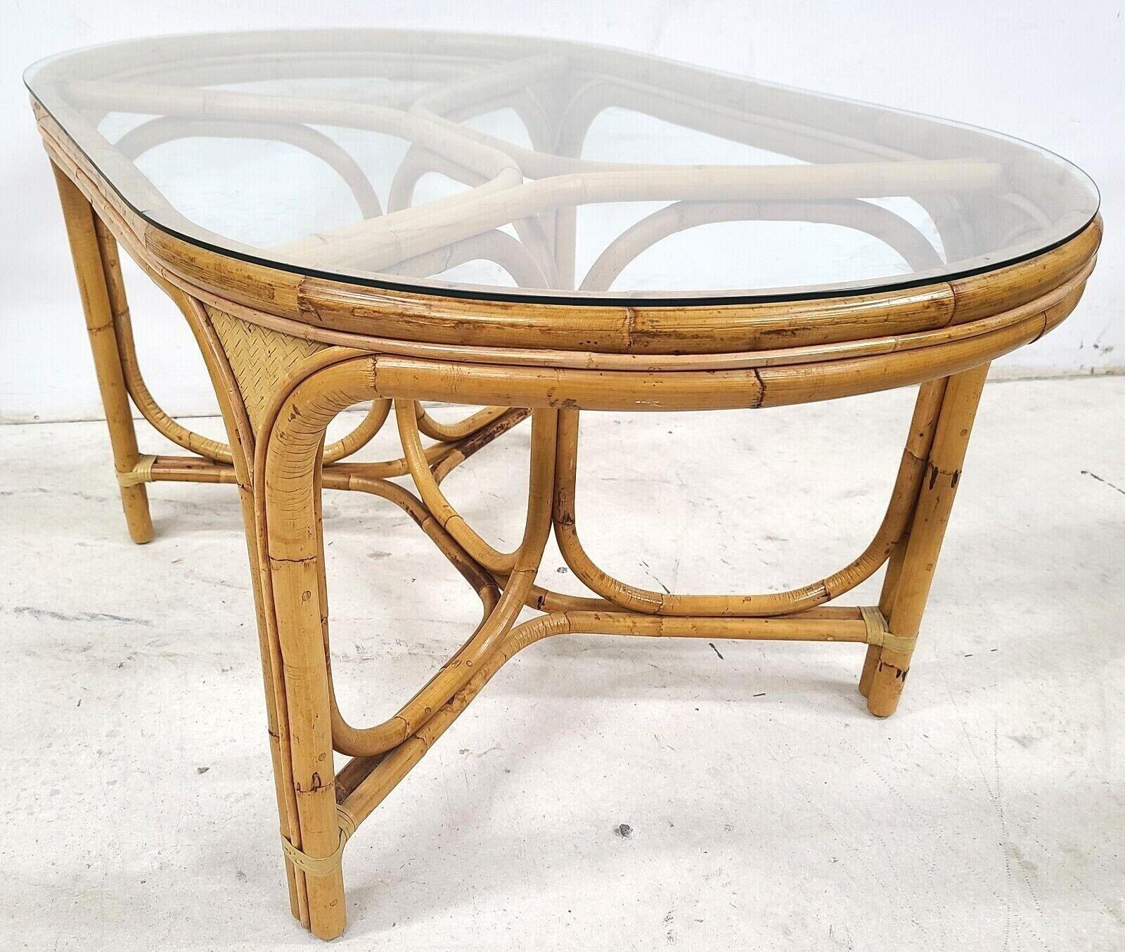Offering one of our recent palm beach estate fine furniture acquisitions of a
Vintage 1970s bamboo rattan glass oval dining table

Extremely well-built and solid.

Approximate measurements in inches
60