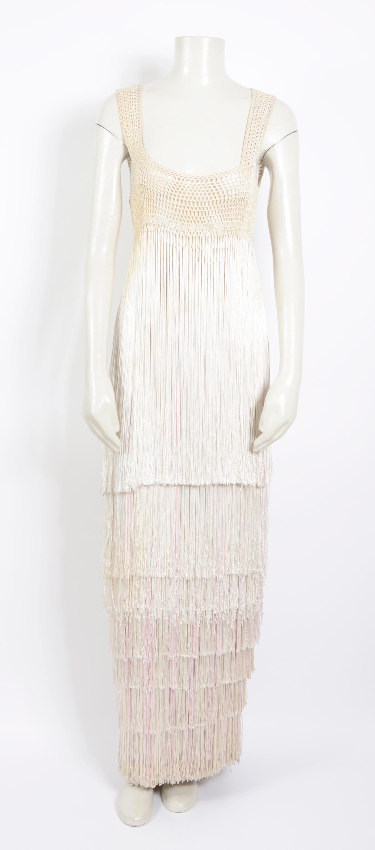 Beautiful collector's item by the Queen of the fringe dresses Belgian designer Ann Salens.
Achieving international renown in the 1970s, Antwerp designer Ann Salens won acclaim for her colorful, crocheted dresses. Working on a hand-operated knitting