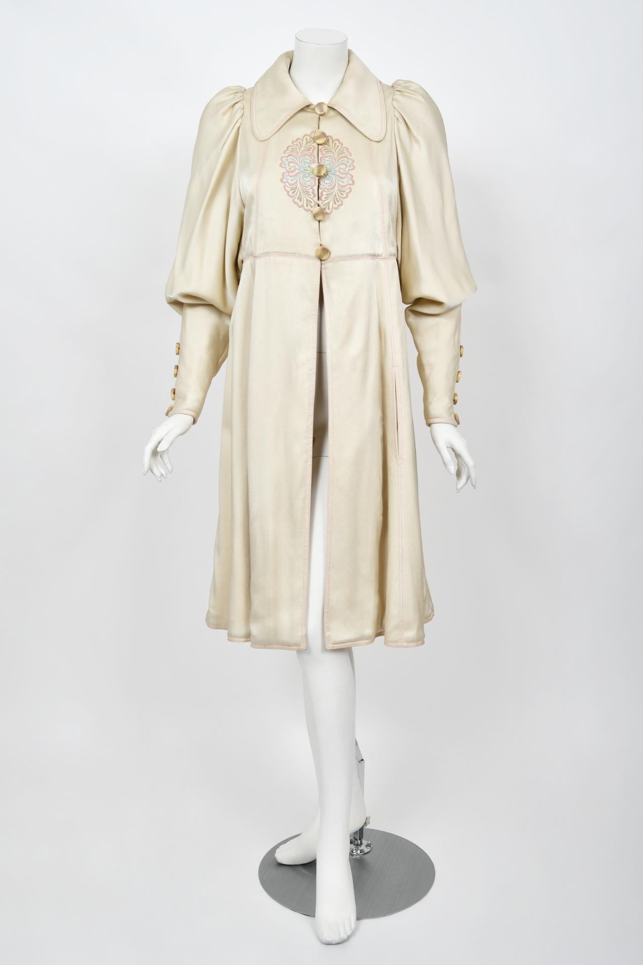 An ultra ethereal Bill Gibb of London couture two-piece ivory satin jacket set dating back to this 1972 fall-winter collection. His garments are very collectible and found in museum's around the globe. Bill Gibb, a forgotten fashion hero from the