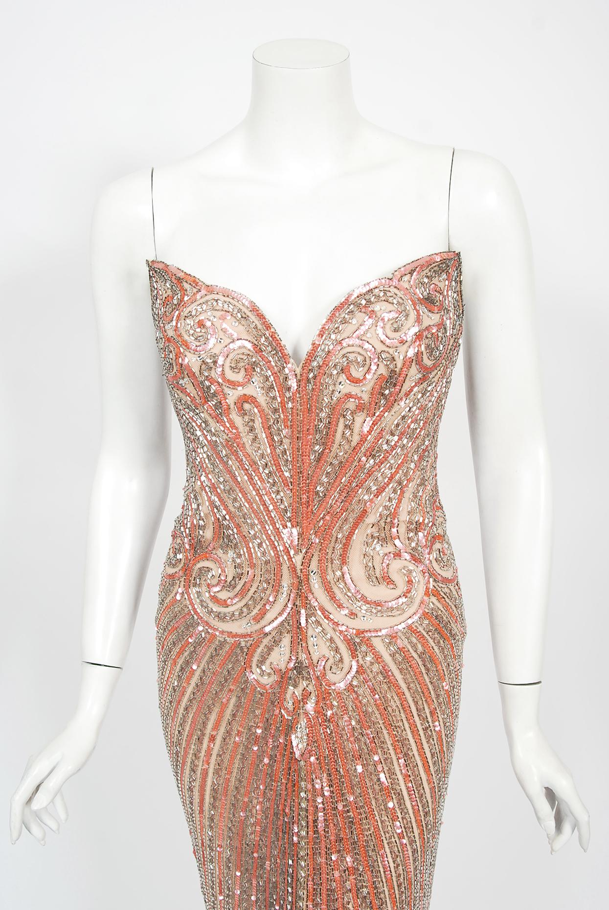 Breathtaking Bob Mackie pink beaded nude-illusion hourglass gown dating back to the late 1970's. Bob Mackie began his career as a Hollywood costuming sketch artist, working for both Edith Head and Jean Louis. While working with designer Ray Aghayan,