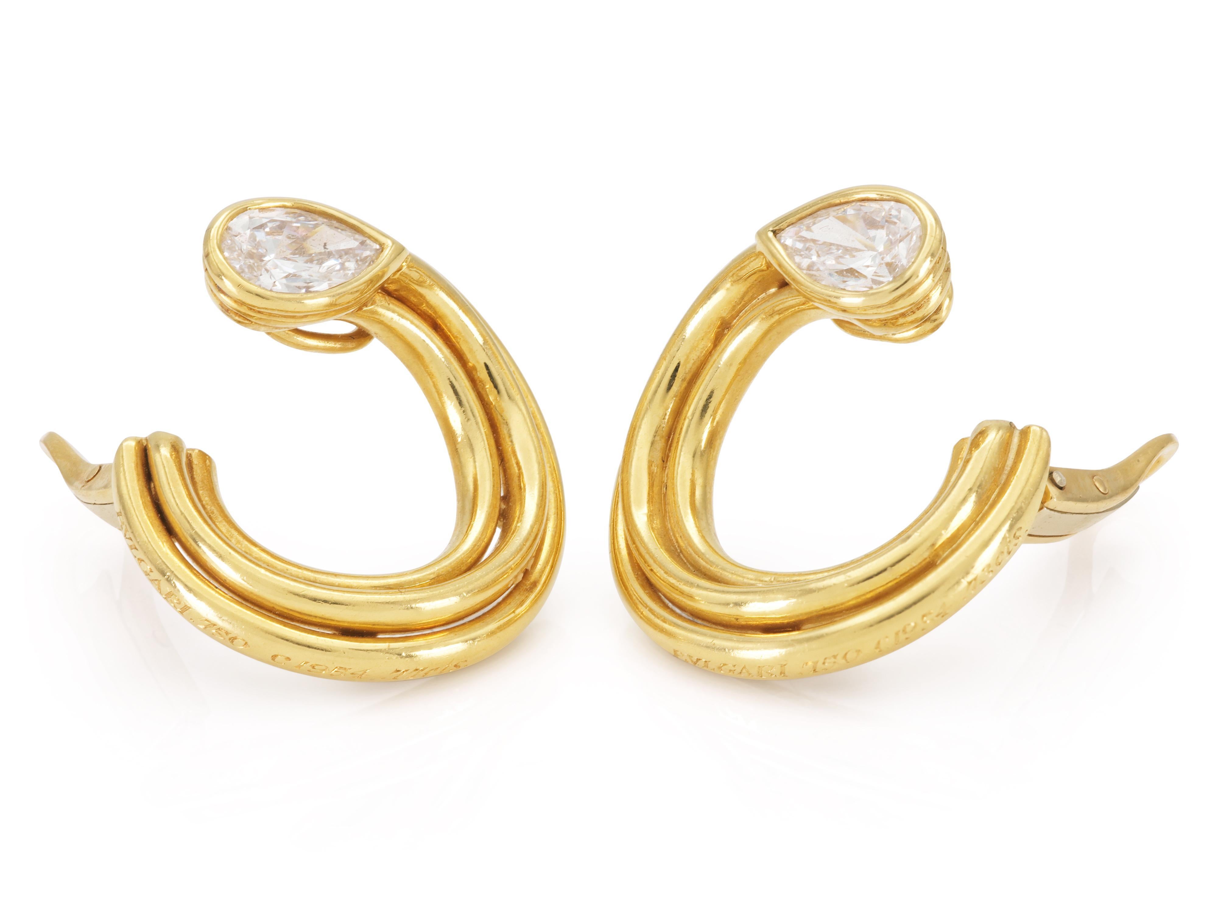 Finely crafted in 18k yellow gold with two Pear-Shaped Diamonds; one weighing 0.77 carat, and the other 0.73 carat, G color, VS2 clarity.
Signed by Bvlgari
Circa 1974