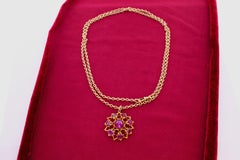 Antique 1910s Cabochon Ruby and Gold Starburst Pendant