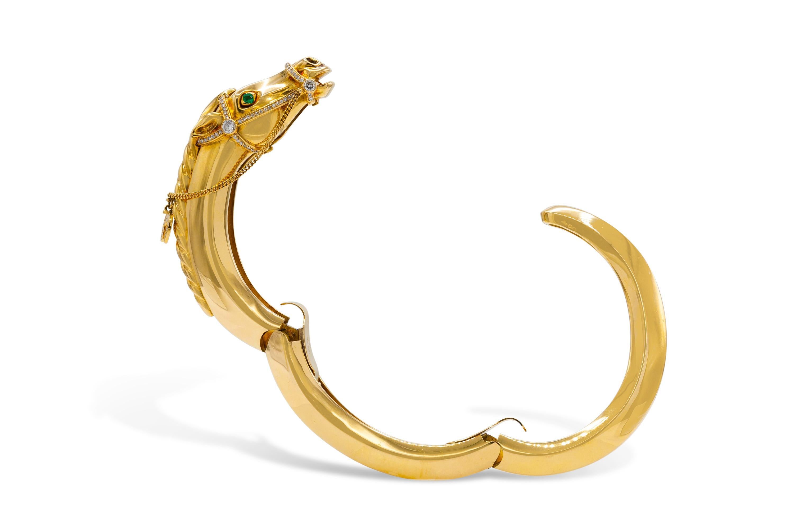 Finely crafted in 18K yellow gold featuring Diamonds and Emeralds for the eyes.
Signed by Cartier
Size 6 1/2 inches
Circa 1970s
